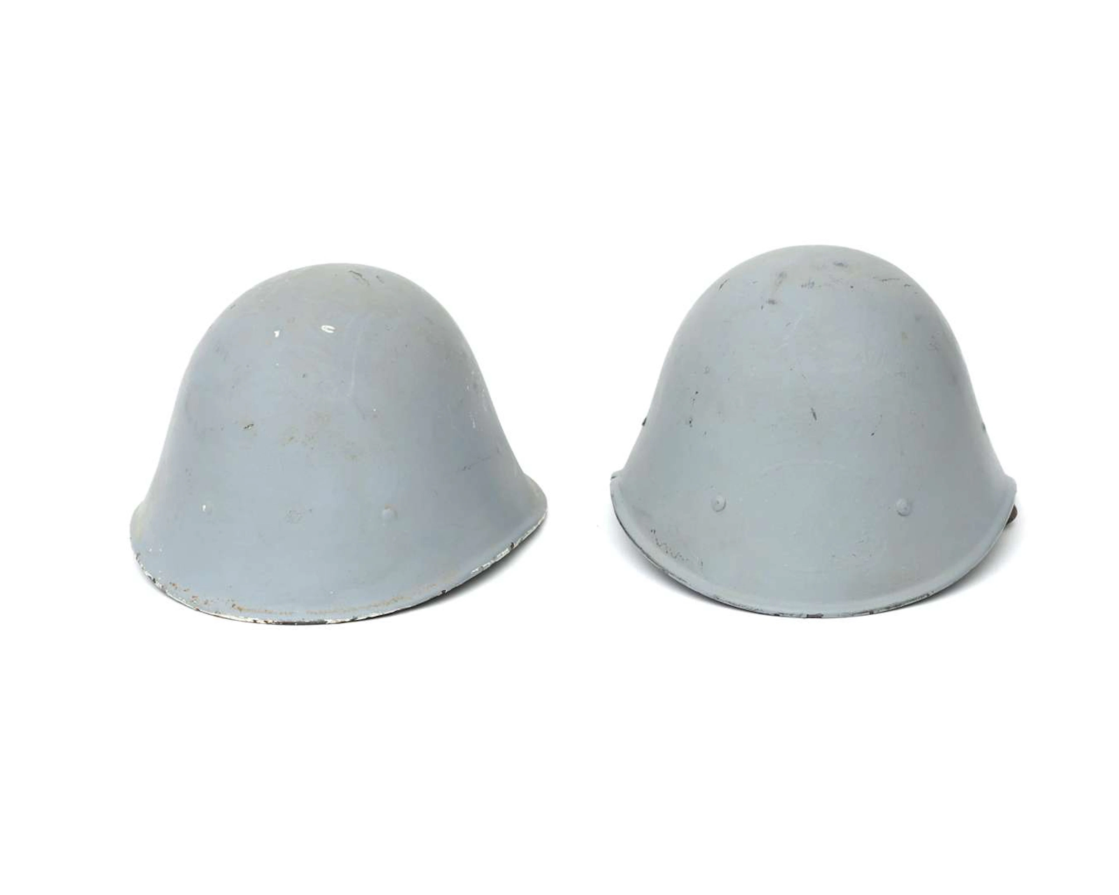 Two helmets by Gerard Cox, model M27, the Netherlands, 20th century