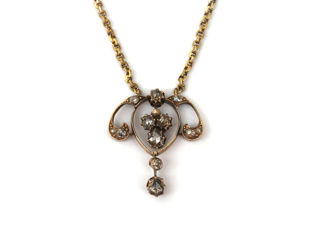 A 14k yellow gold necklace with a rose-cut diamond, late 19th century