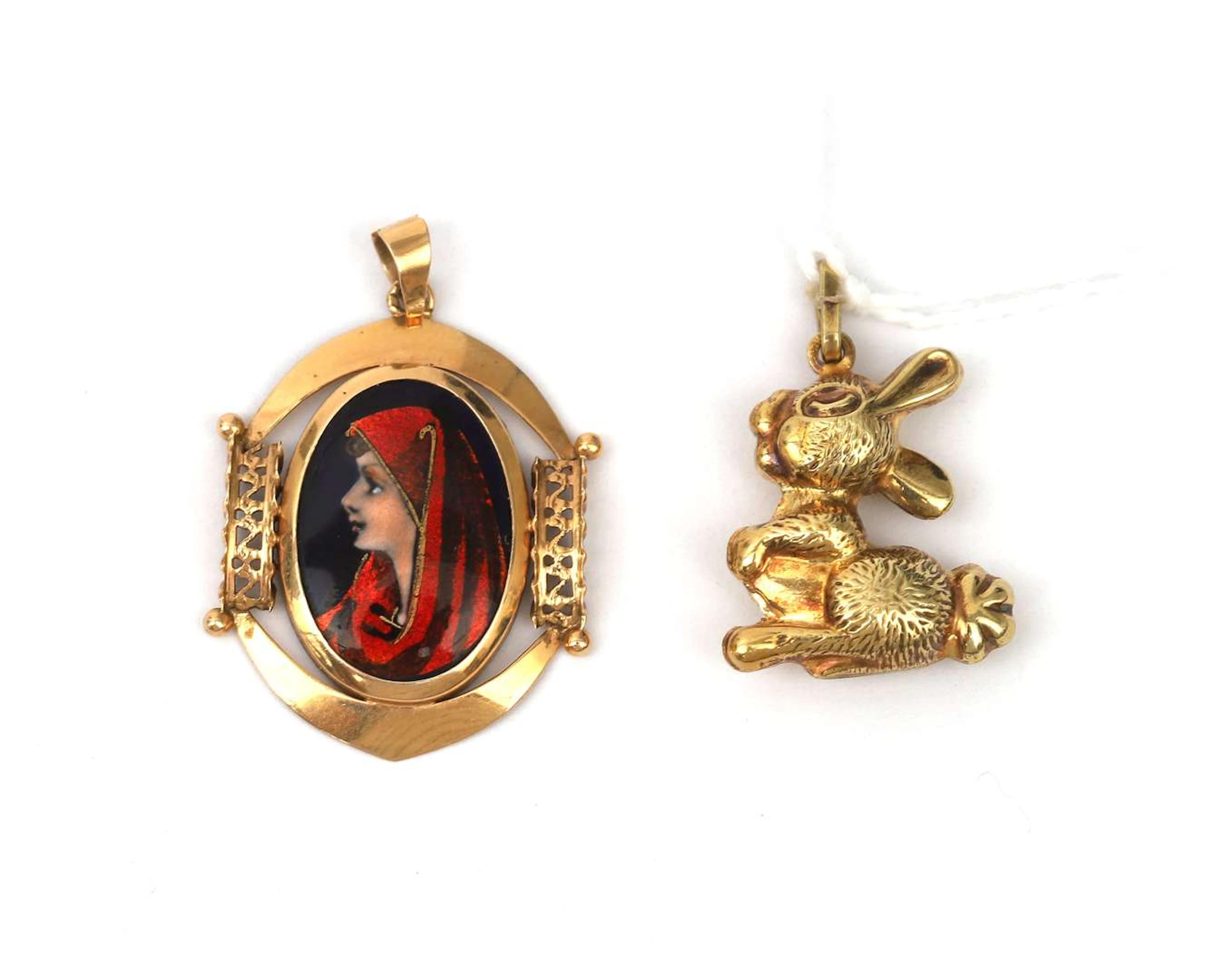 Two 14-carat gold pendants, one of which features a Limoges enamel portrait