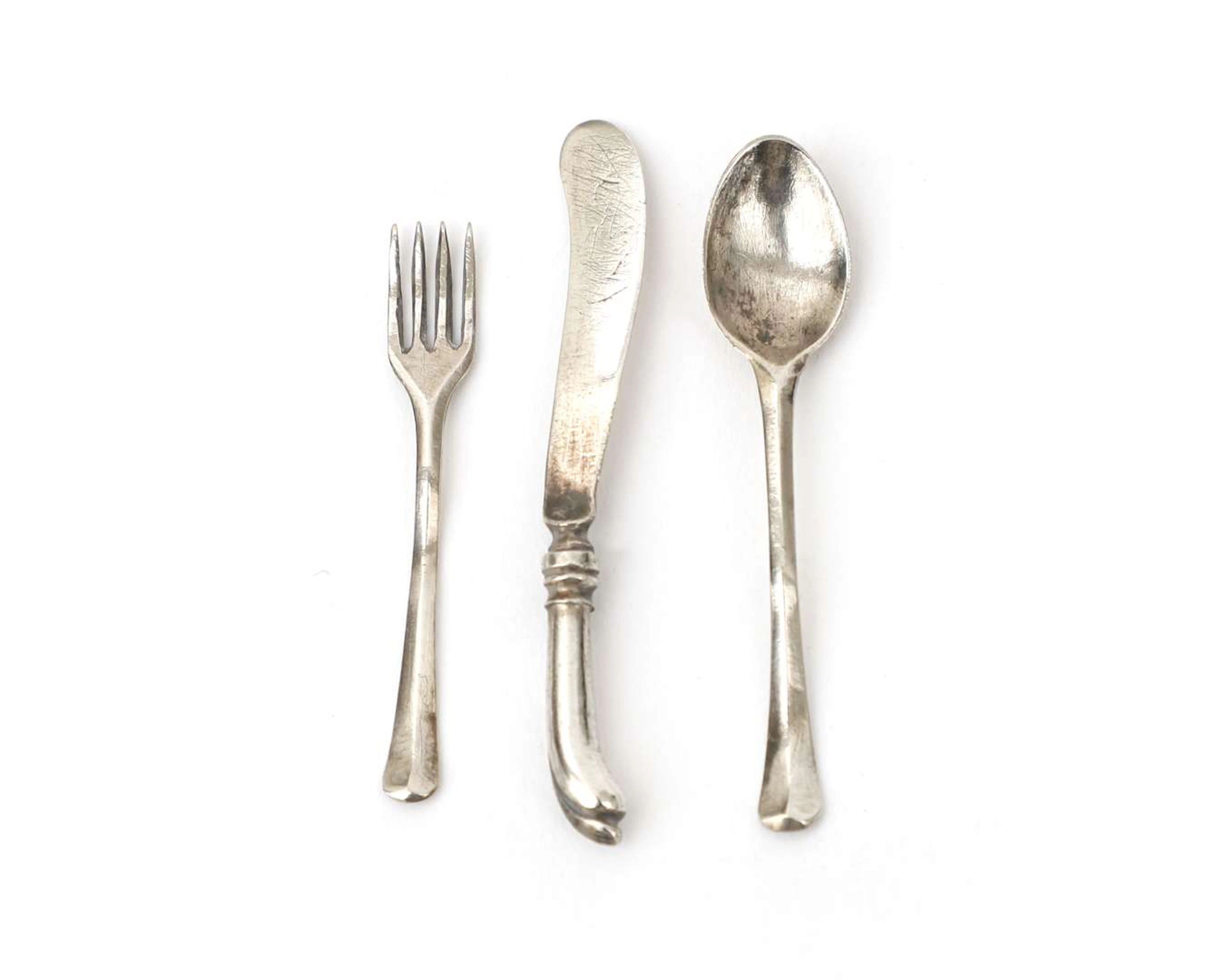 Three miniature silver cutlery items, Holland, 18th century