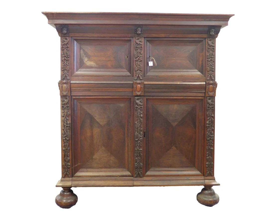 A four-door walnut cabinet with scrollwork. 18th/19th century