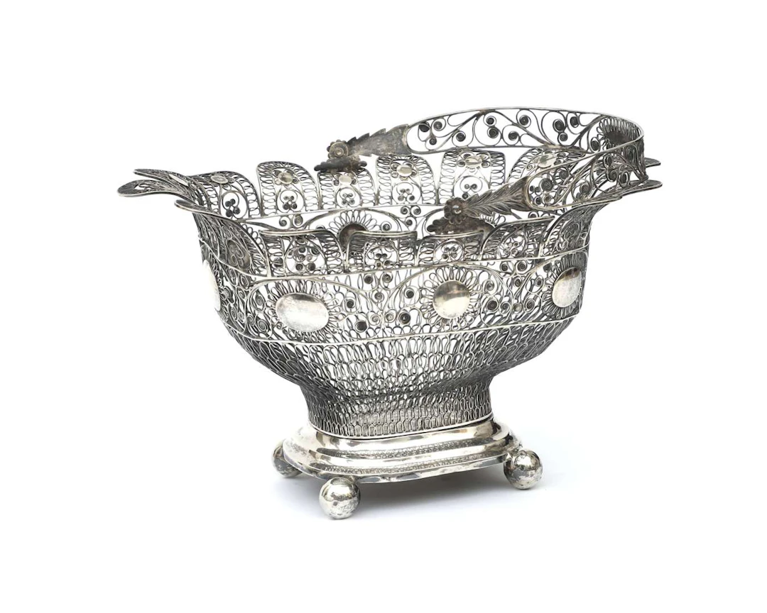 A silver filigree basket, probably from the Dutch East Indies, late