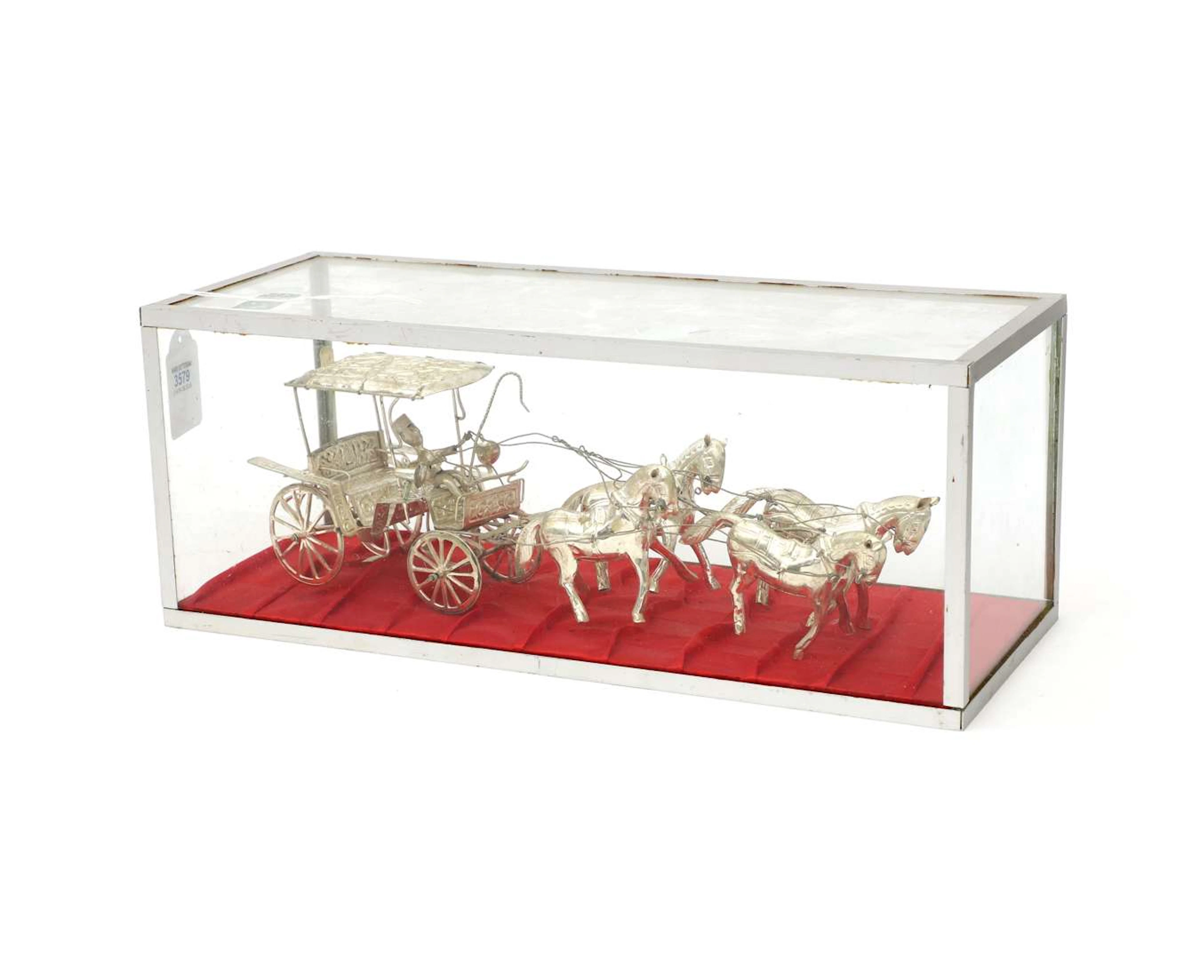 A silver-coloured miniature carriage, Asia, 20th century