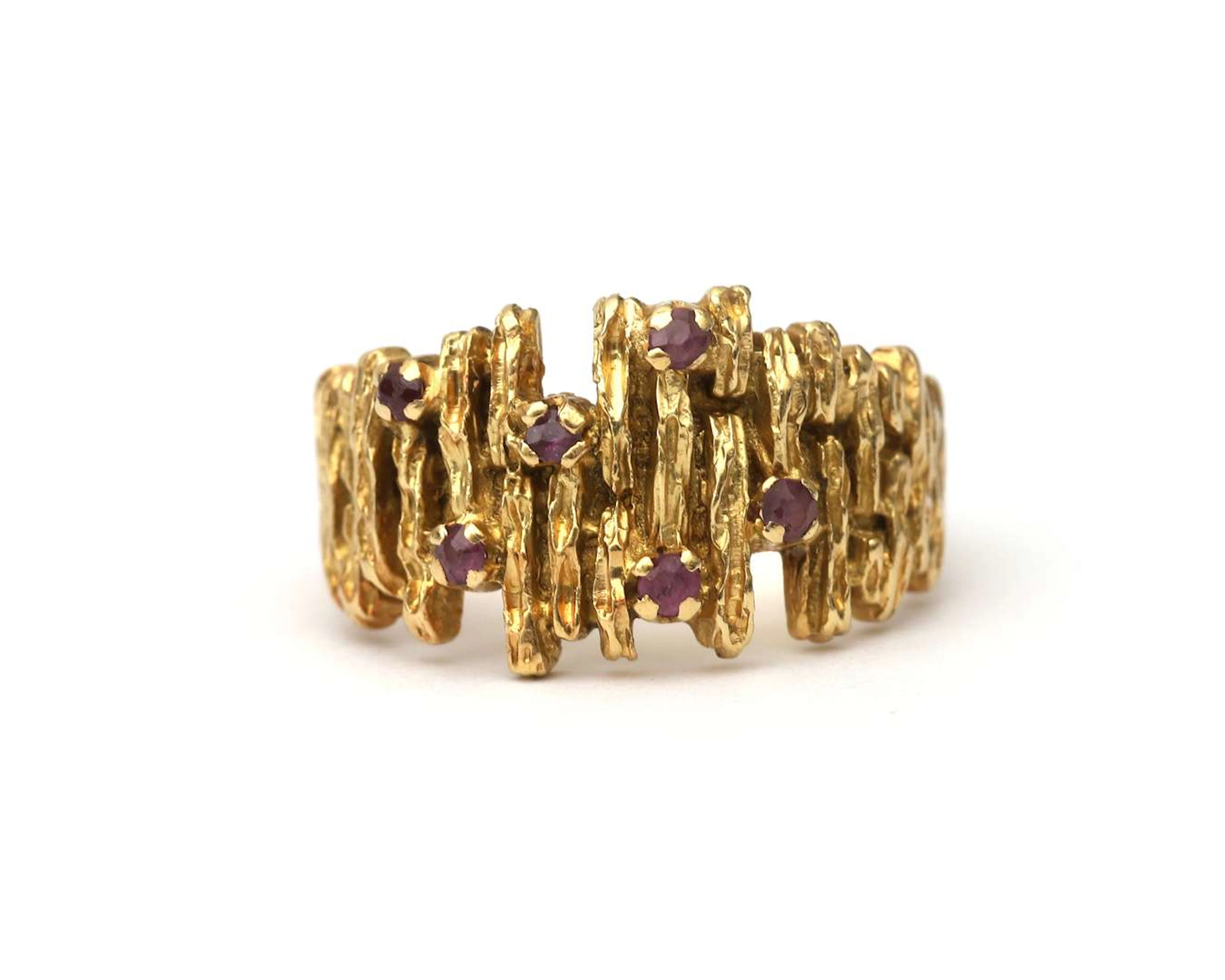 An 18-carat yellow gold ring with a ruby