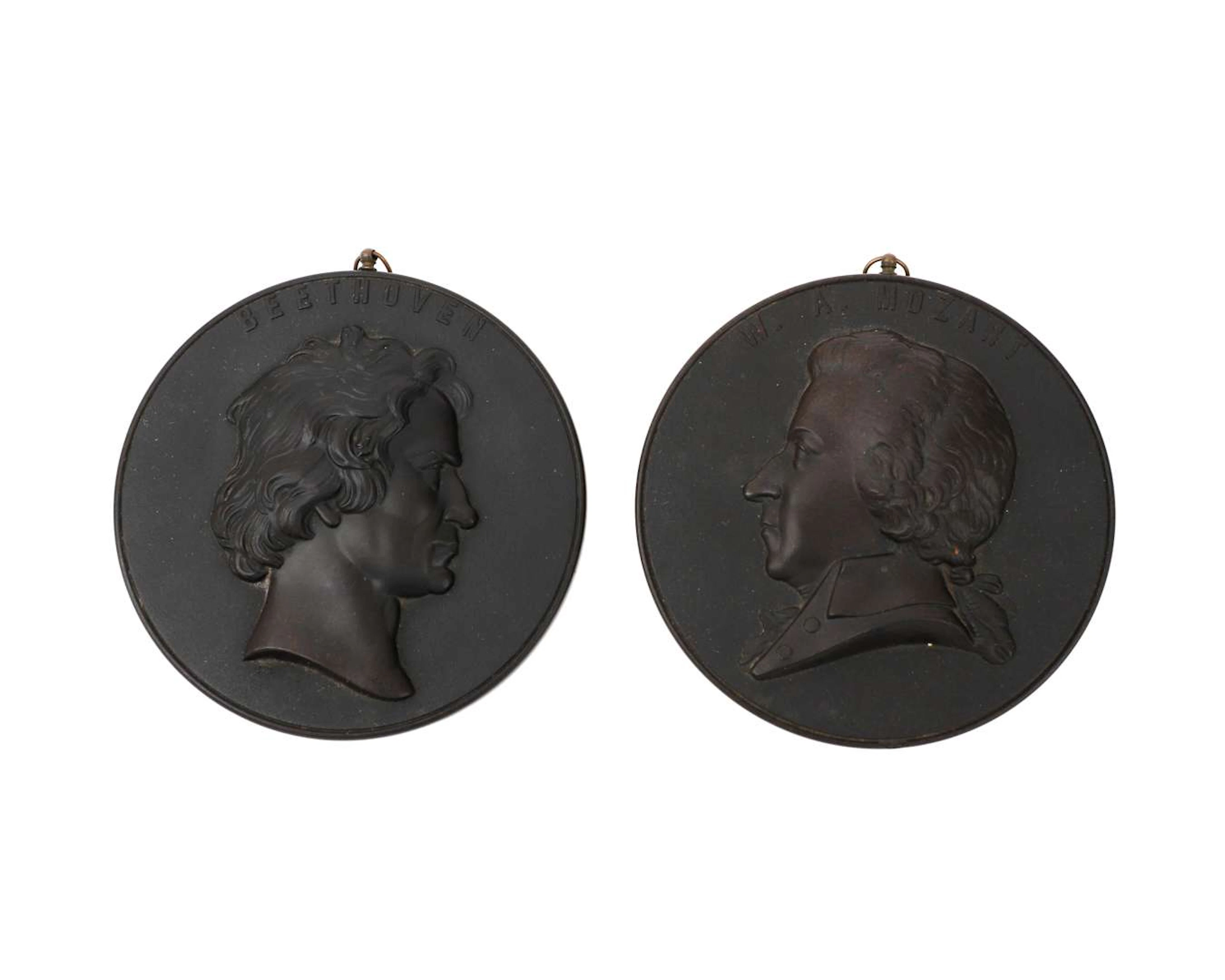 Two hard-wood portrait medallions, ‘W.A. Mozart’ and ‘Beethoven’
