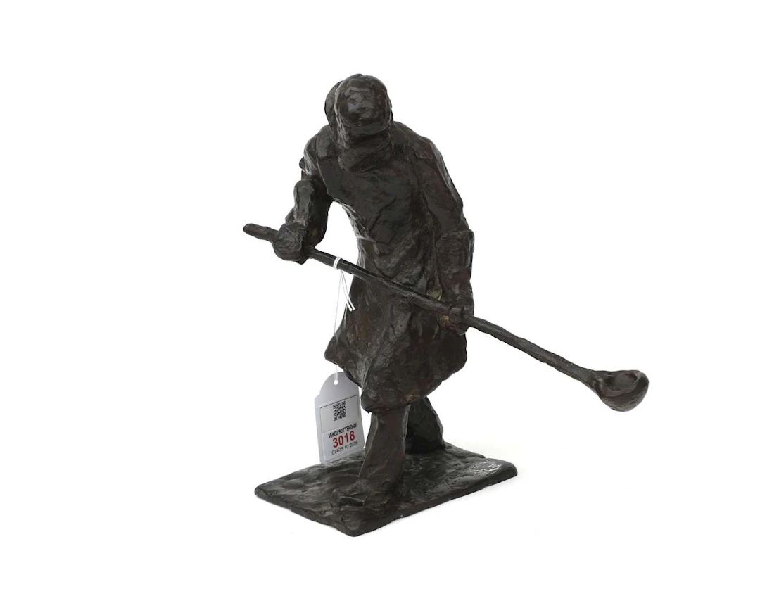 A bronze sculpture of a bronze caster, 20th century