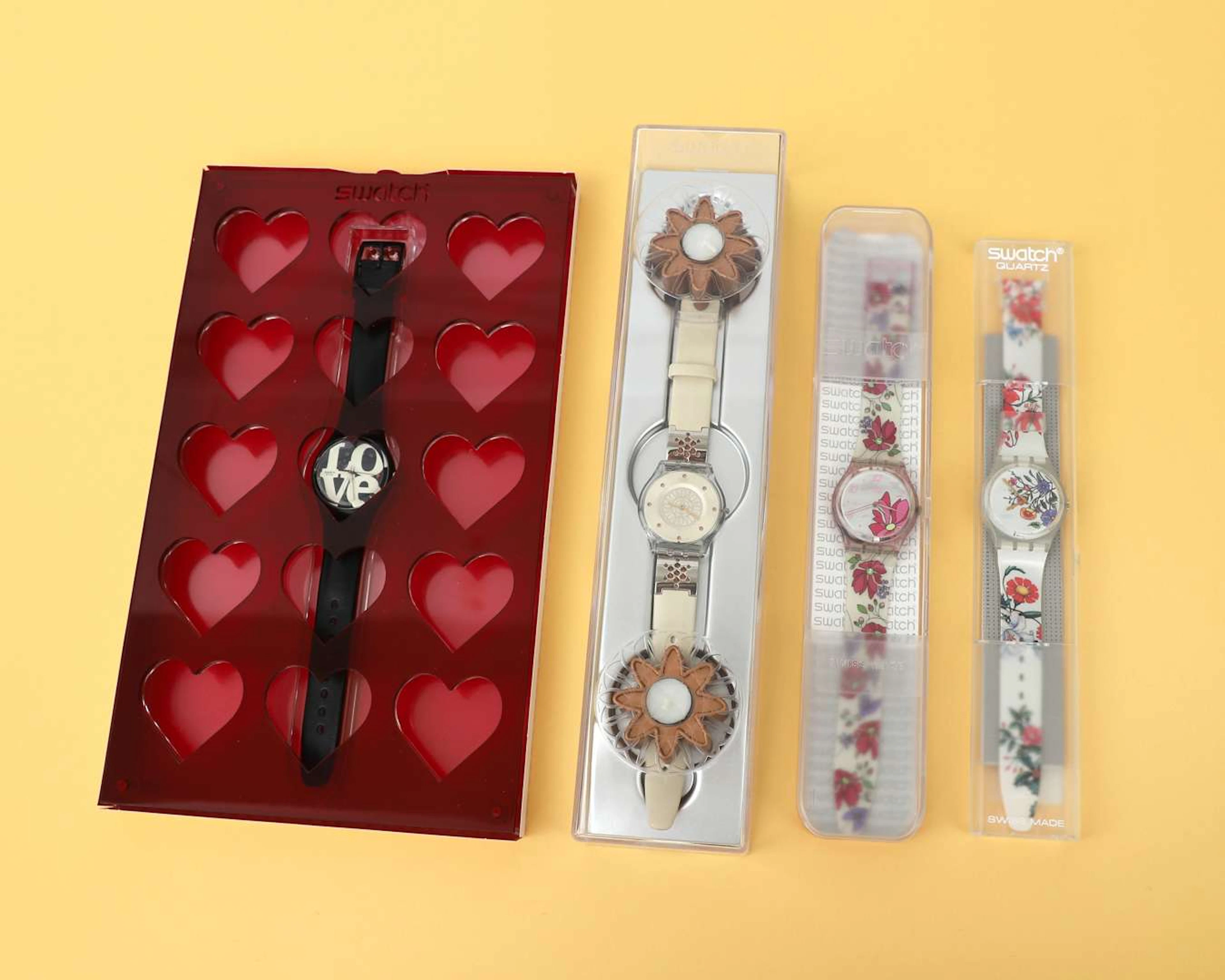 Four Swatch wristwatches, including ‘Enigmatic Love by Robert Indiana’