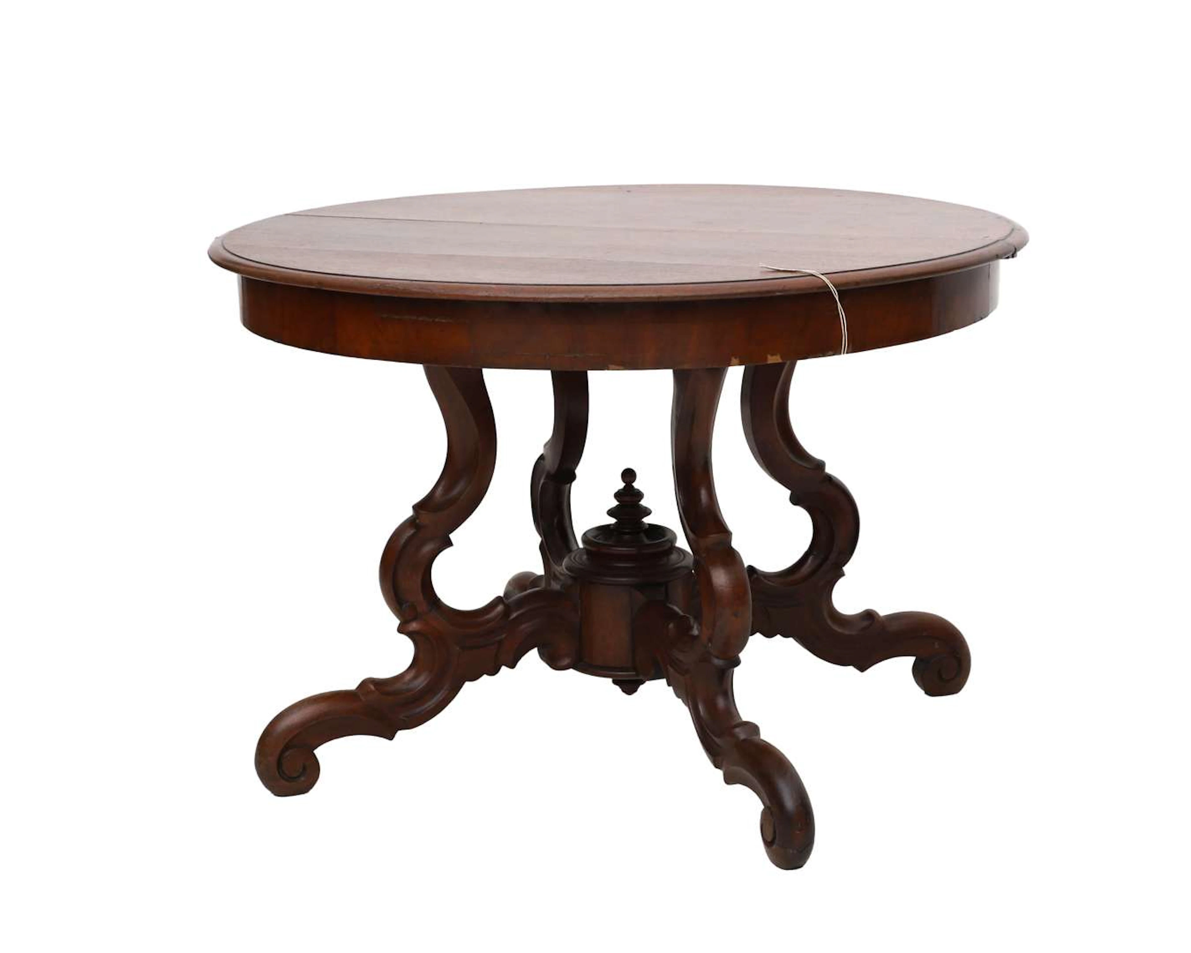 A round veneered dining table, 20th century