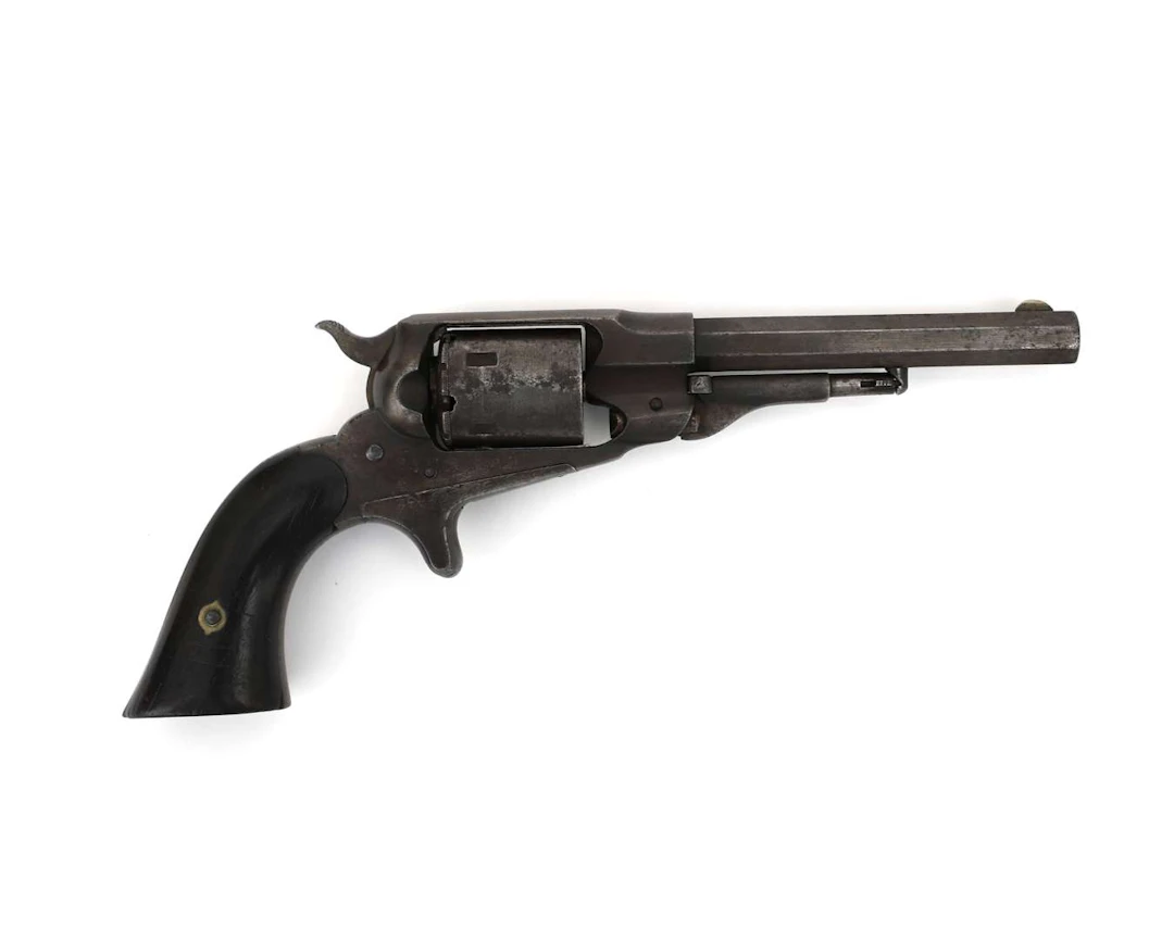 A pocket-sized conversion rimfire revolver, manufactured by: Remington