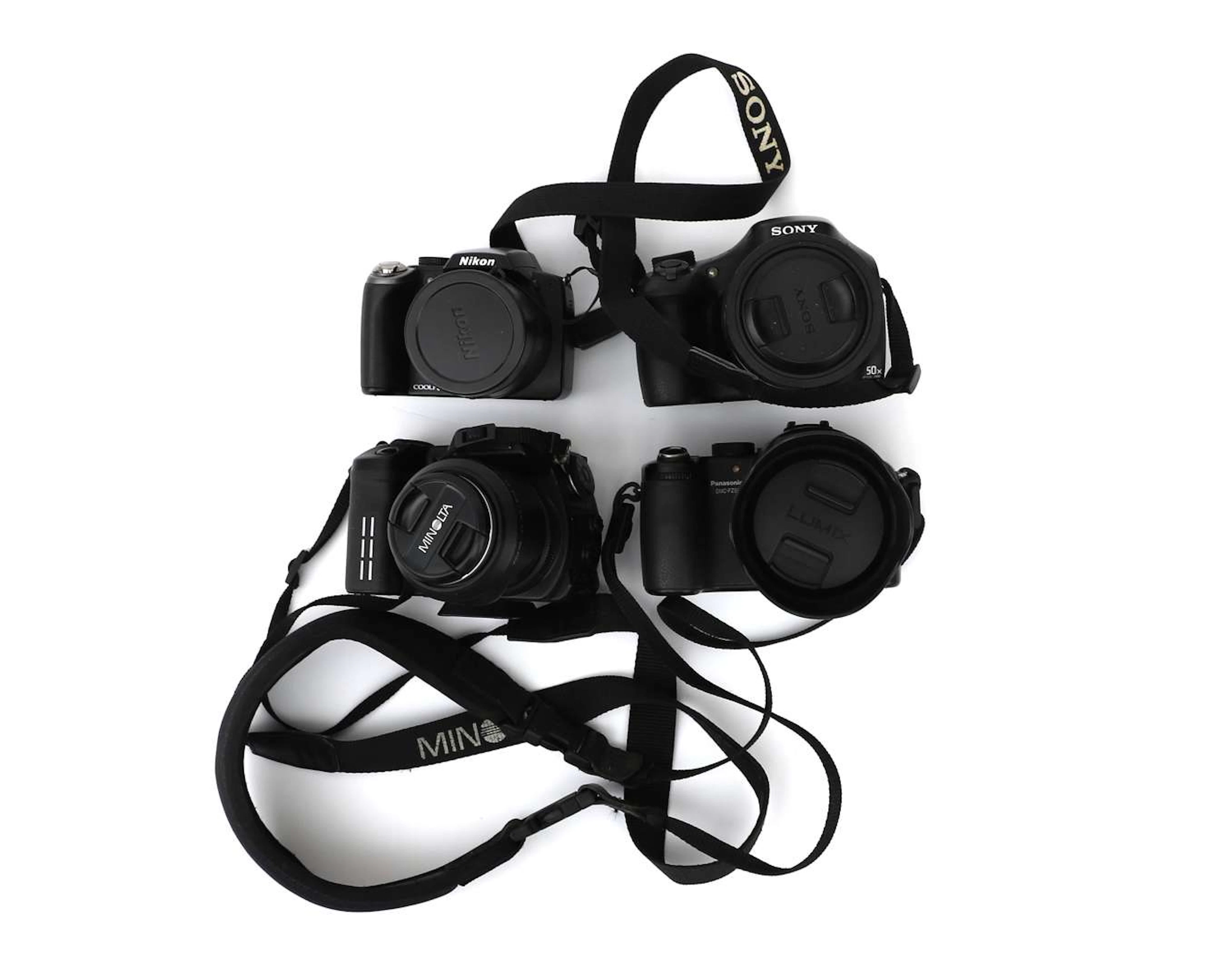Four digital cameras from Nikon, Sony, Panasonic and Minolta