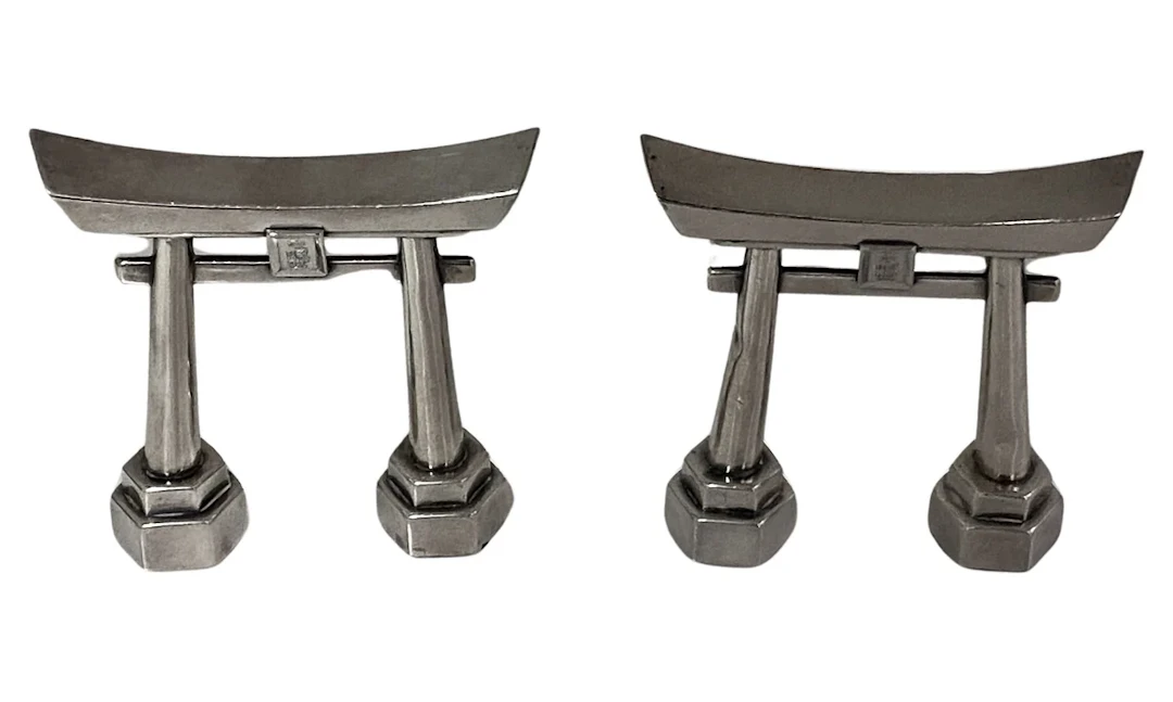 Pair of Sterling Silver Shinto Gates Casters C.1950.