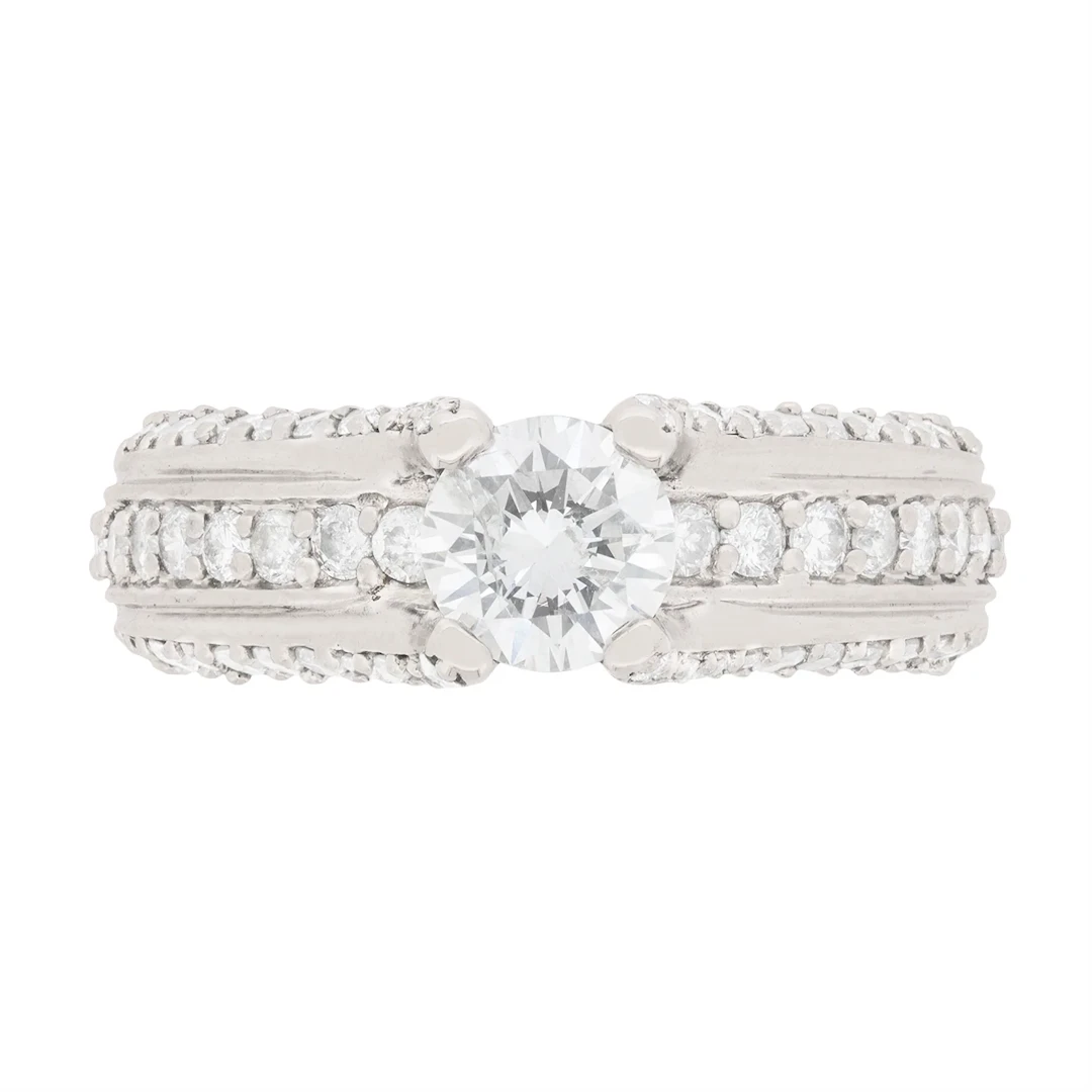 0.65 Carat Diamond Solitaire with Pave Set Diamond Shoulders