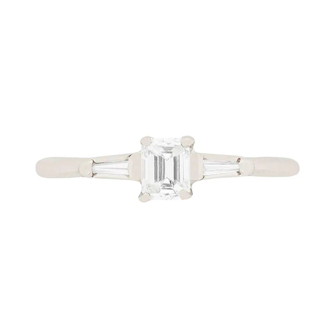 Contemporary 0.25ct Emerald Cut Diamond Engagement Ring with Tension