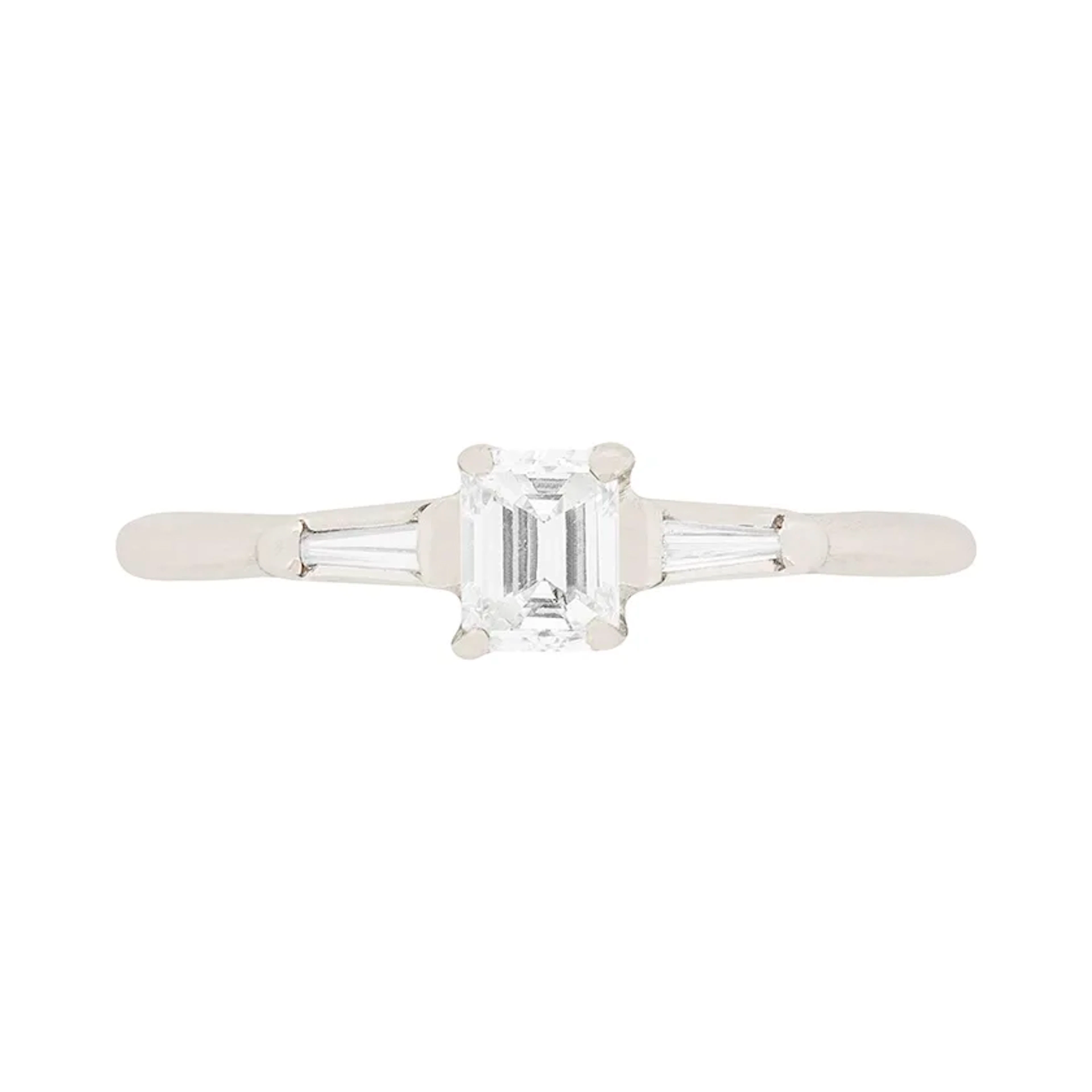 Contemporary 0.25ct Emerald Cut Diamond Engagement Ring with Tension