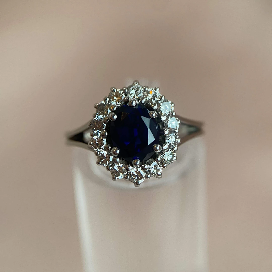 White gold ring with dark blue sapphire and diamonds (2000–2010)