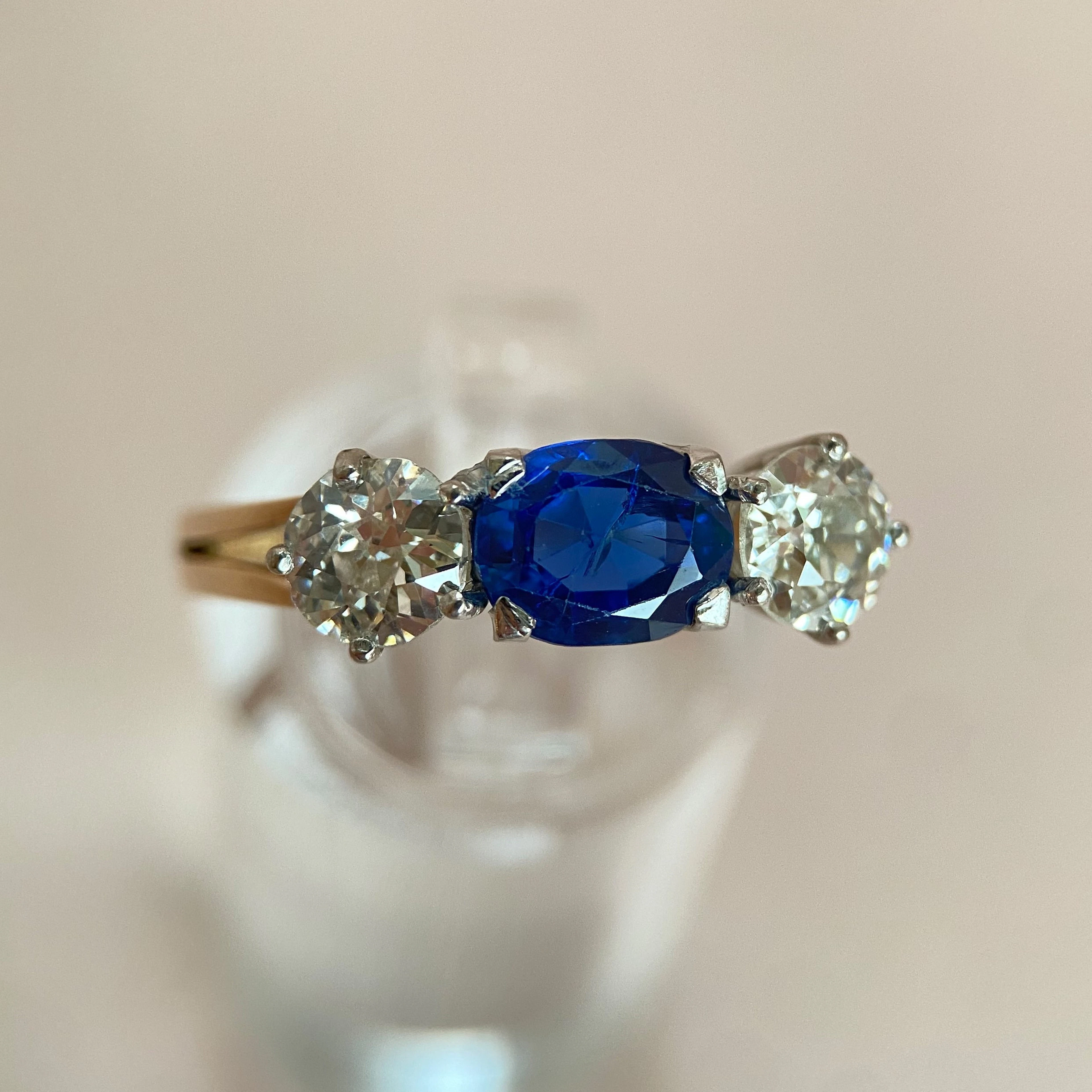 Blue 1.5 ct sapphire ring with two diamonds totaling 1.1 ct: “Rare Luck”