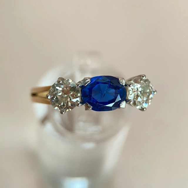 Blue 1.5 ct sapphire ring with two diamonds totaling 1.1 ct: “Rare Luck”