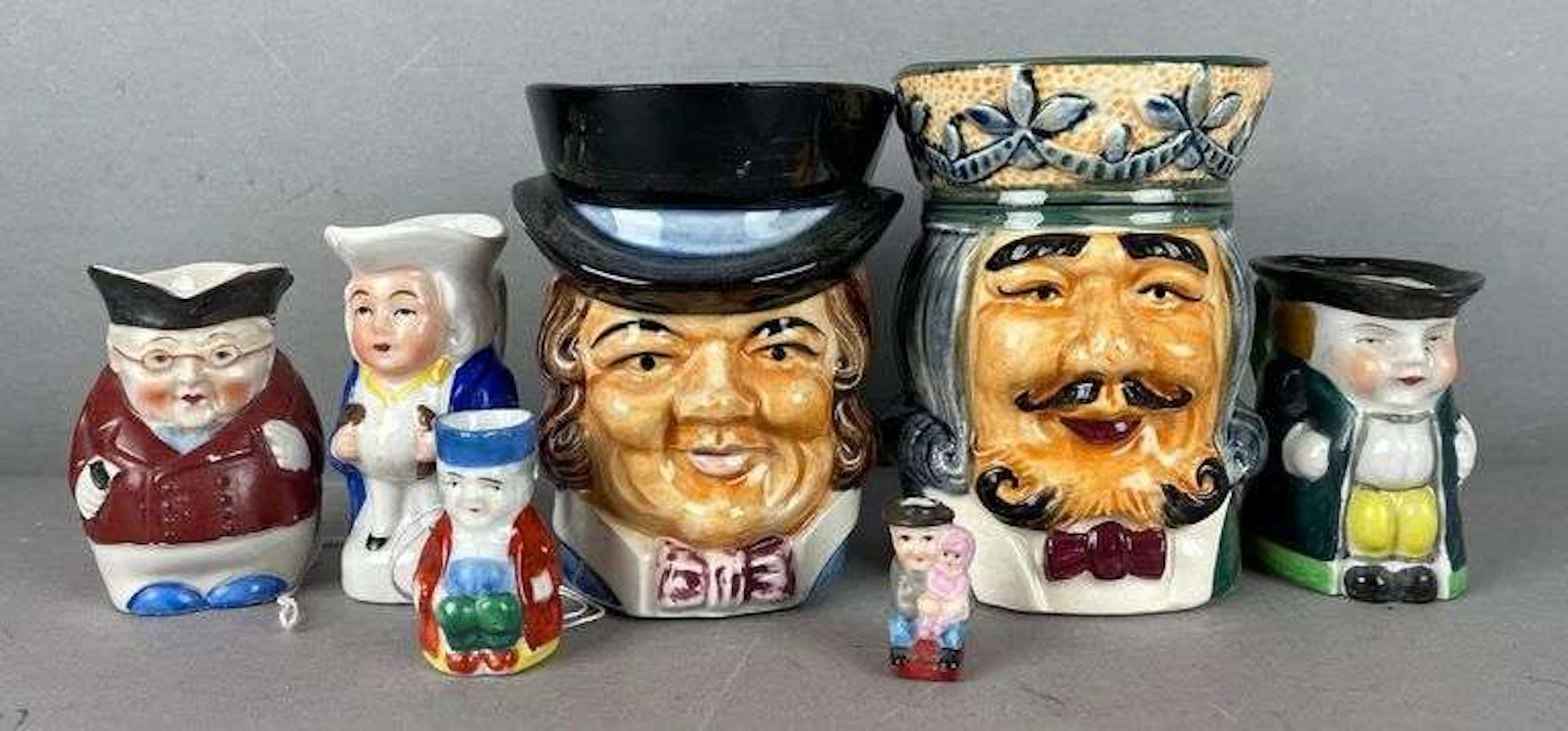 Group of Occupied Japan Toby Mugs and Creamers