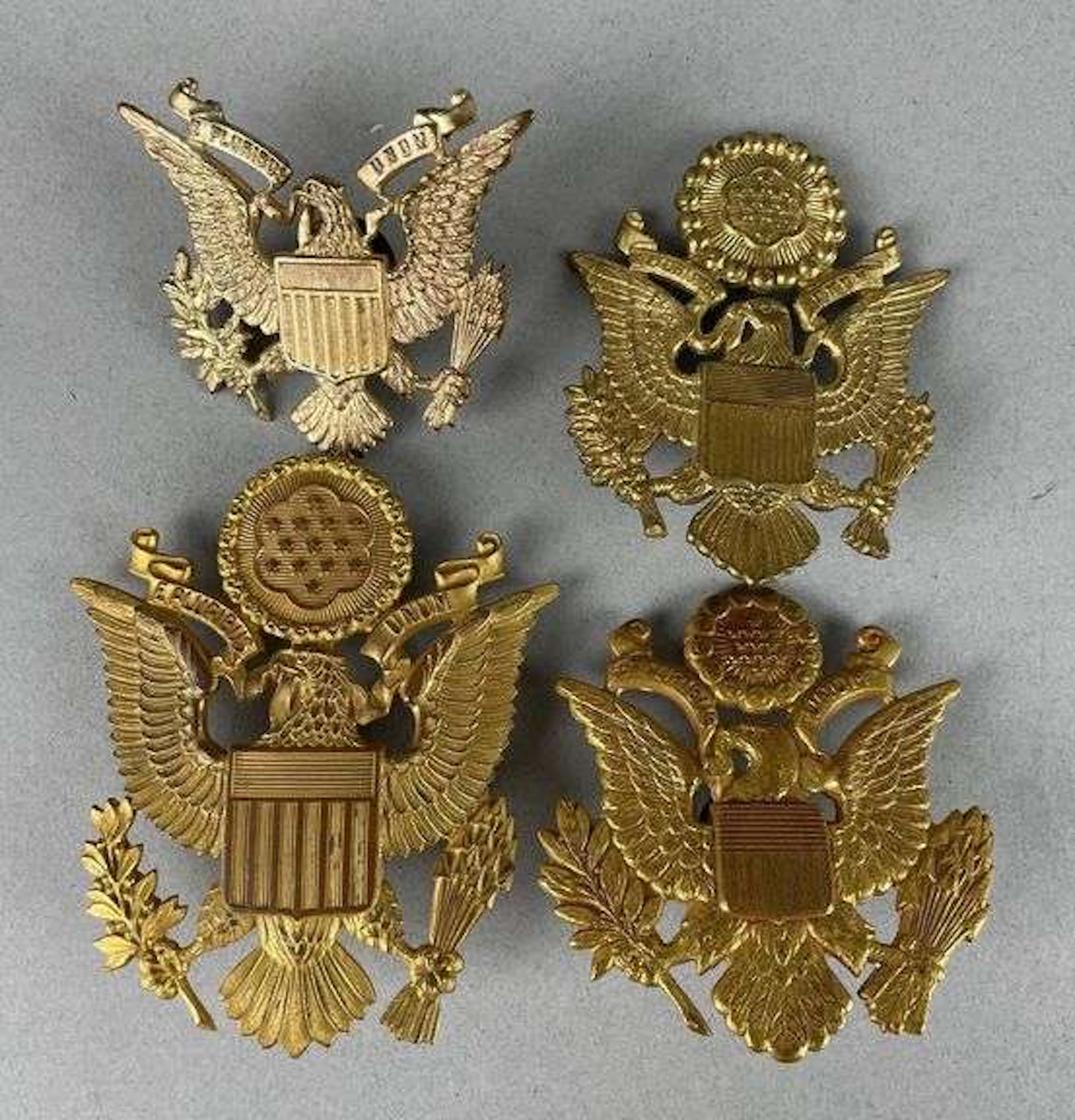 Group of 4 WW2 U.S. Military Cap Eagle Badges