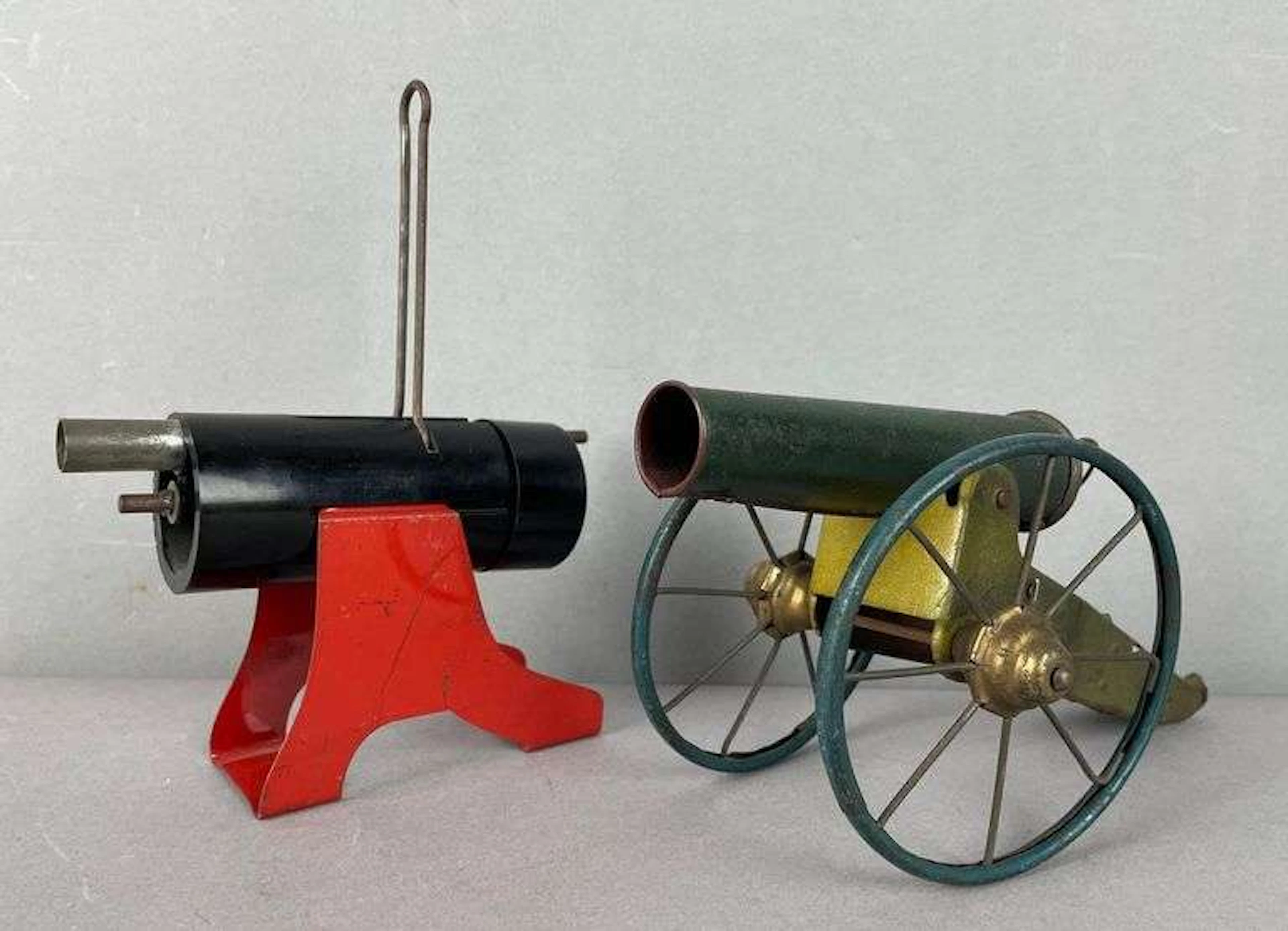 Group of 2 Vintage Tin Litho Cannons