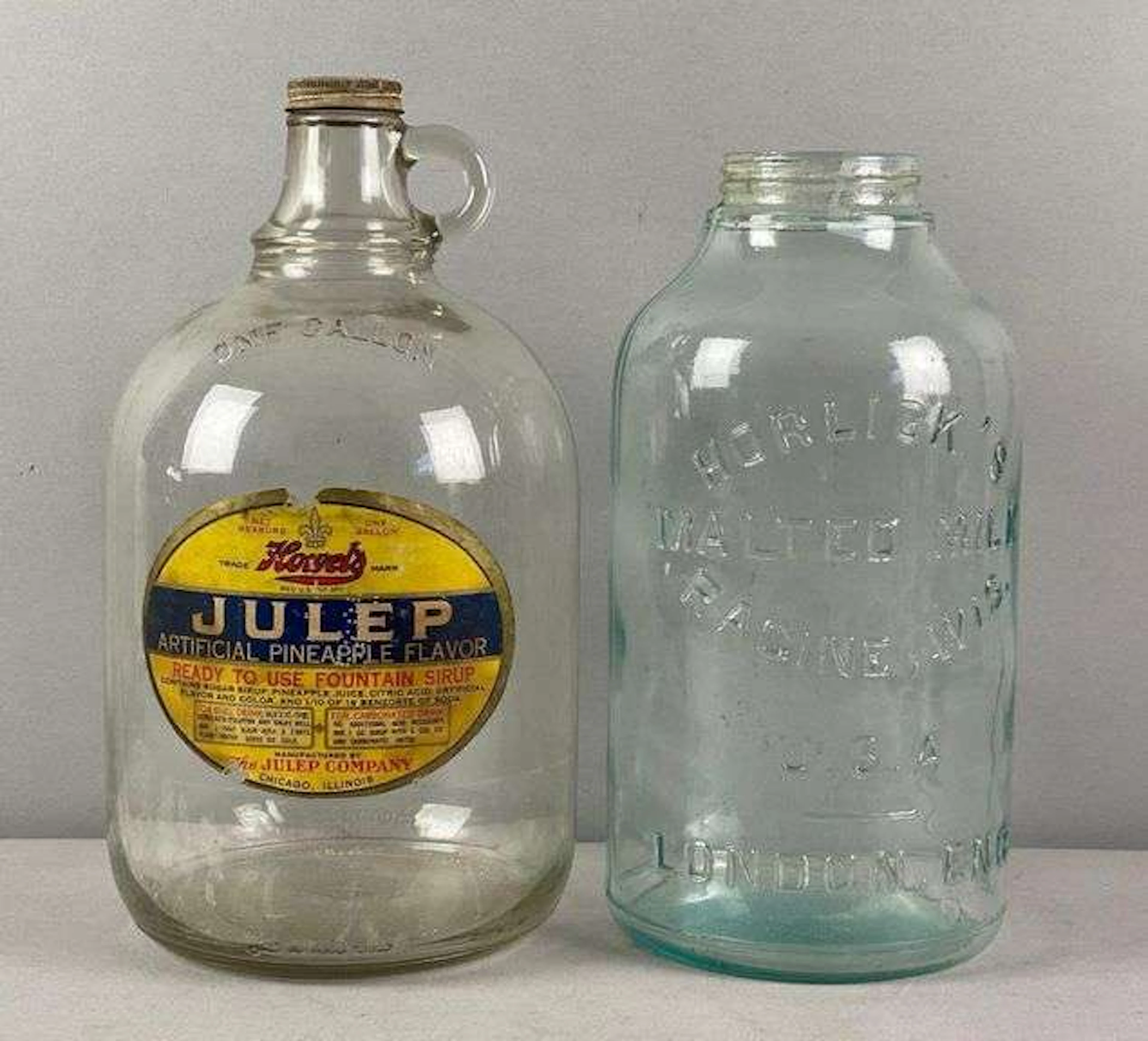 Group of 2 Vintage Glass Advertising Jugs