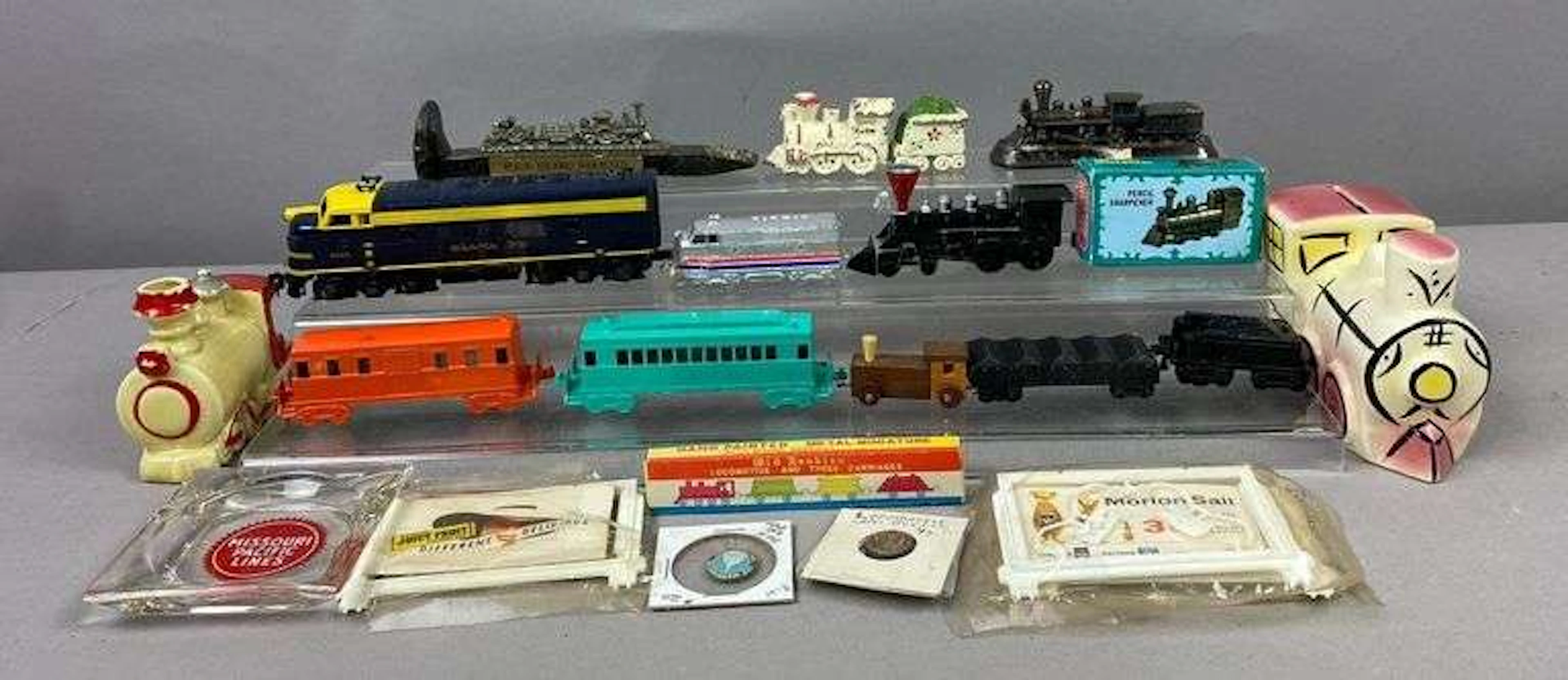 Group of Locomotive Themed Toys and More