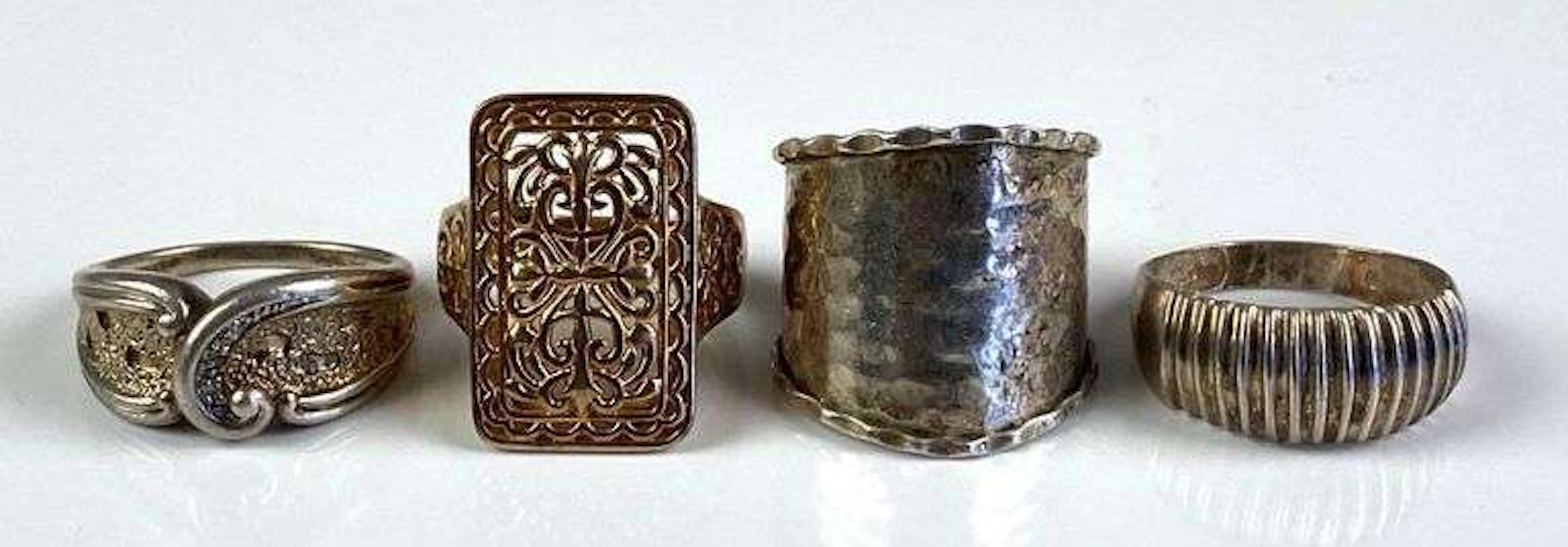 Group of 4 Sterling Silver Unique Rings