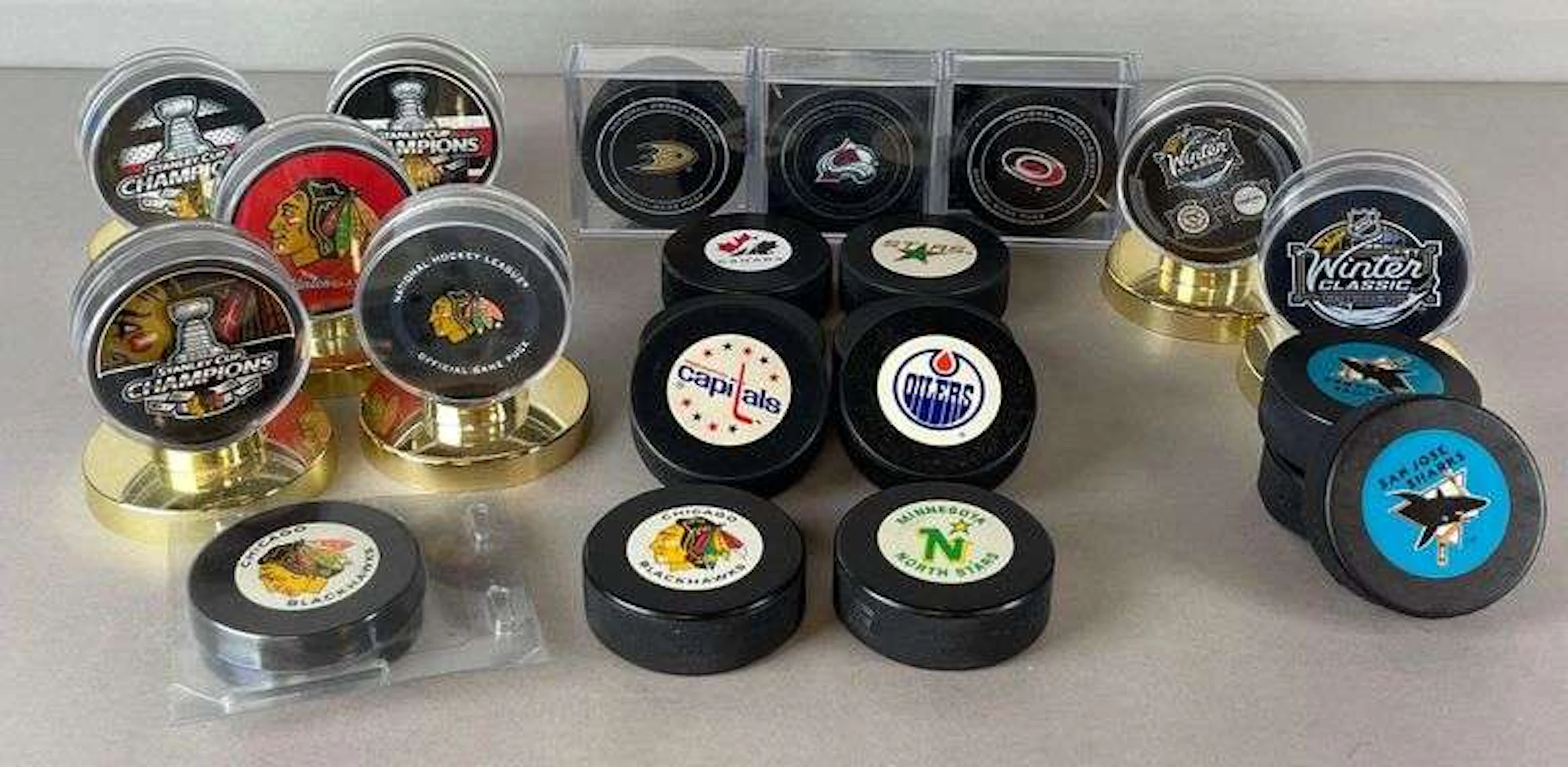 20+ NHL Hockey Pucks