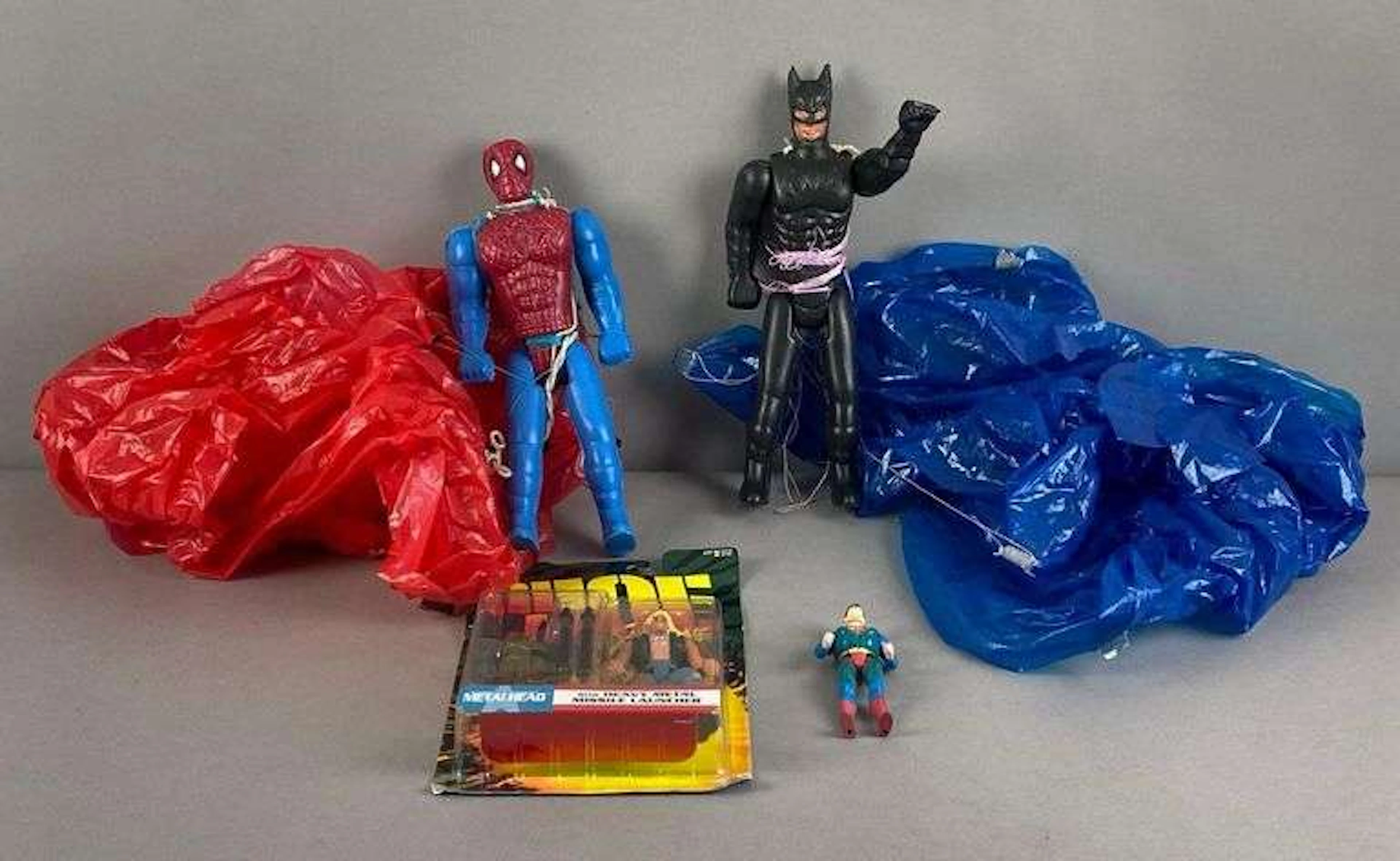 Group of 4 Superhero Figurines and GI Joe Figurine