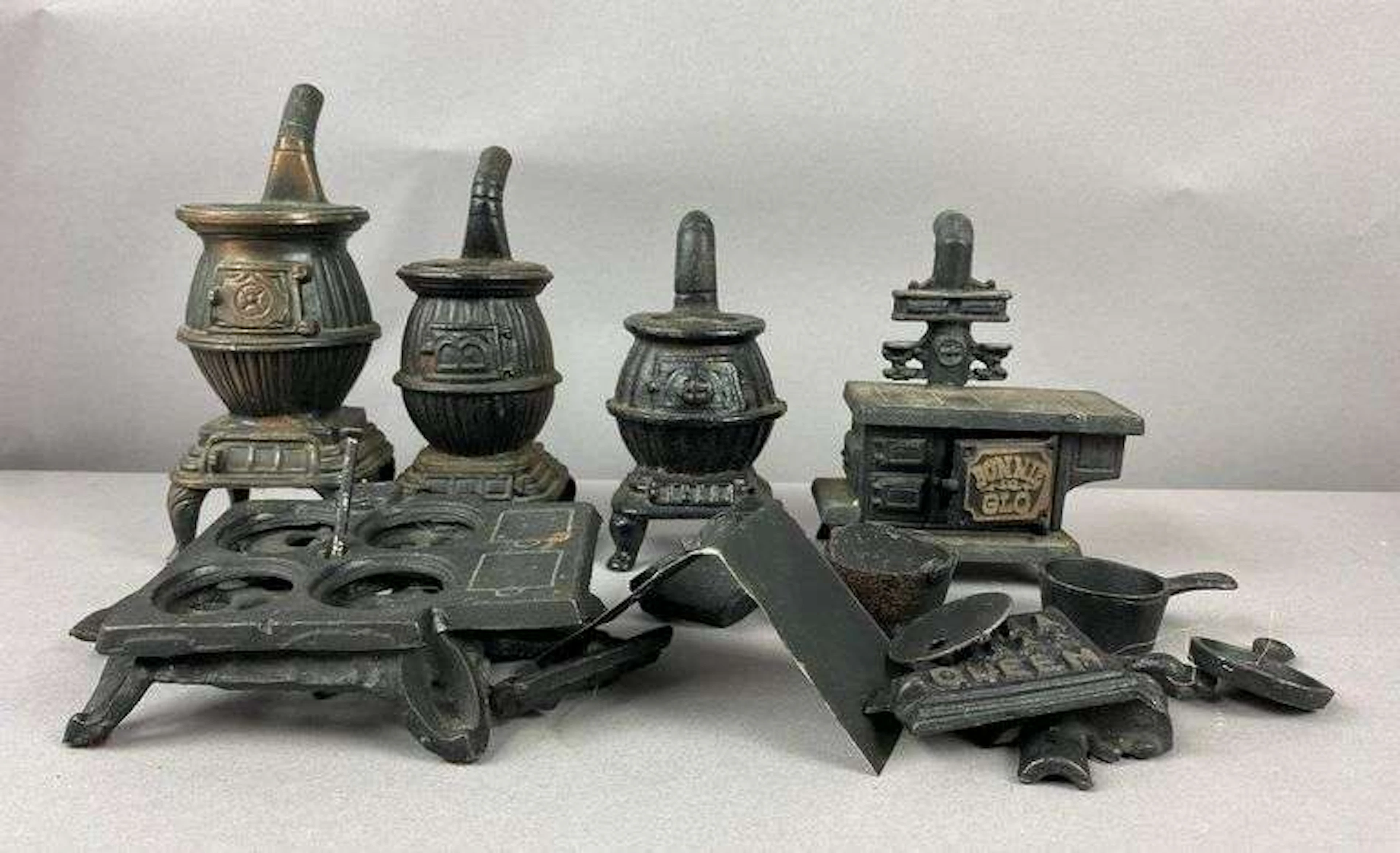 Group of Vintage Cast Iron Pot Belly Stoves and More