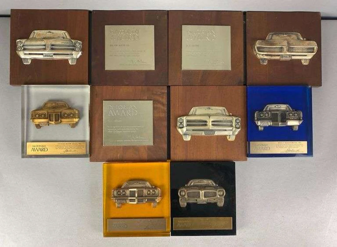 Group of 7 De Lorean/McDonald Automobile Dealership Award Plaques