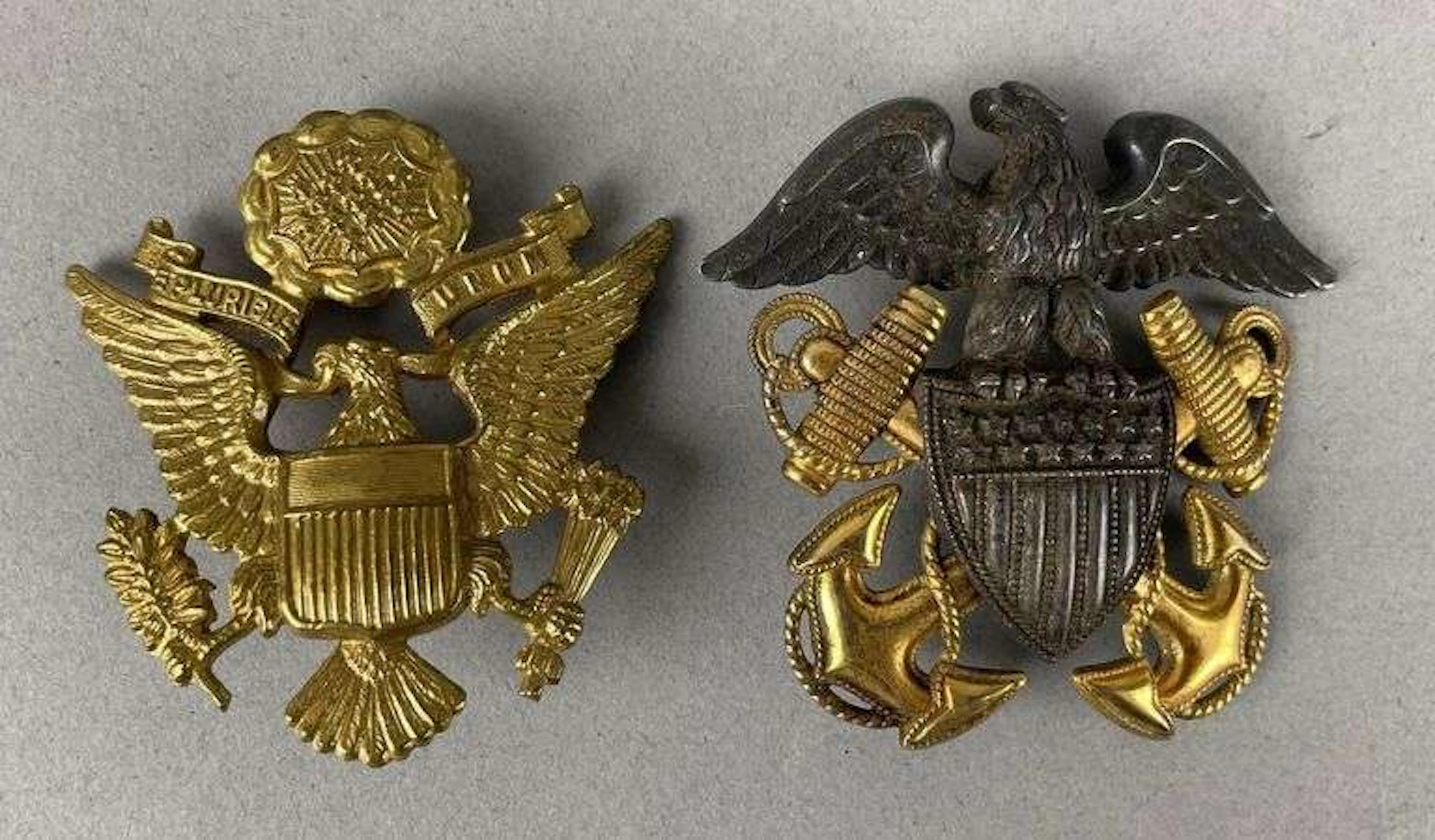 Group of 2 WW2 U.S. Military Cap Badges