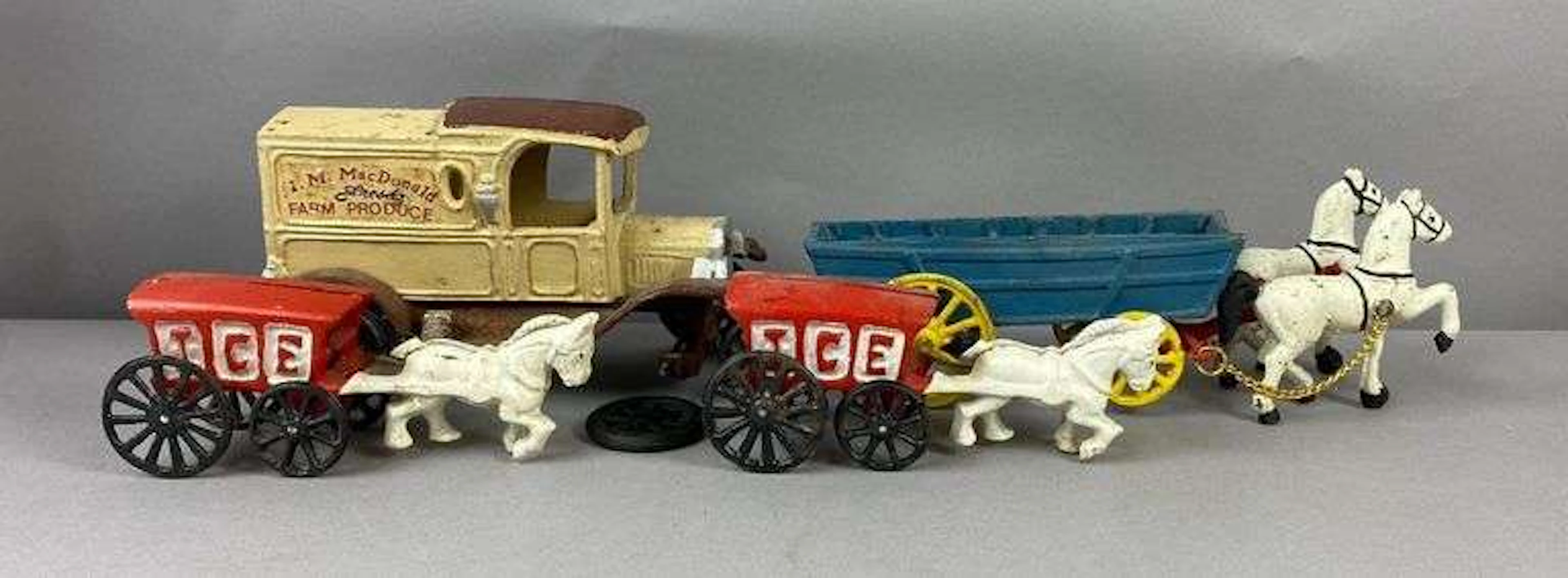 Group of 4 Reproduction Cast Iron Horse Drawn Delivery Wagons