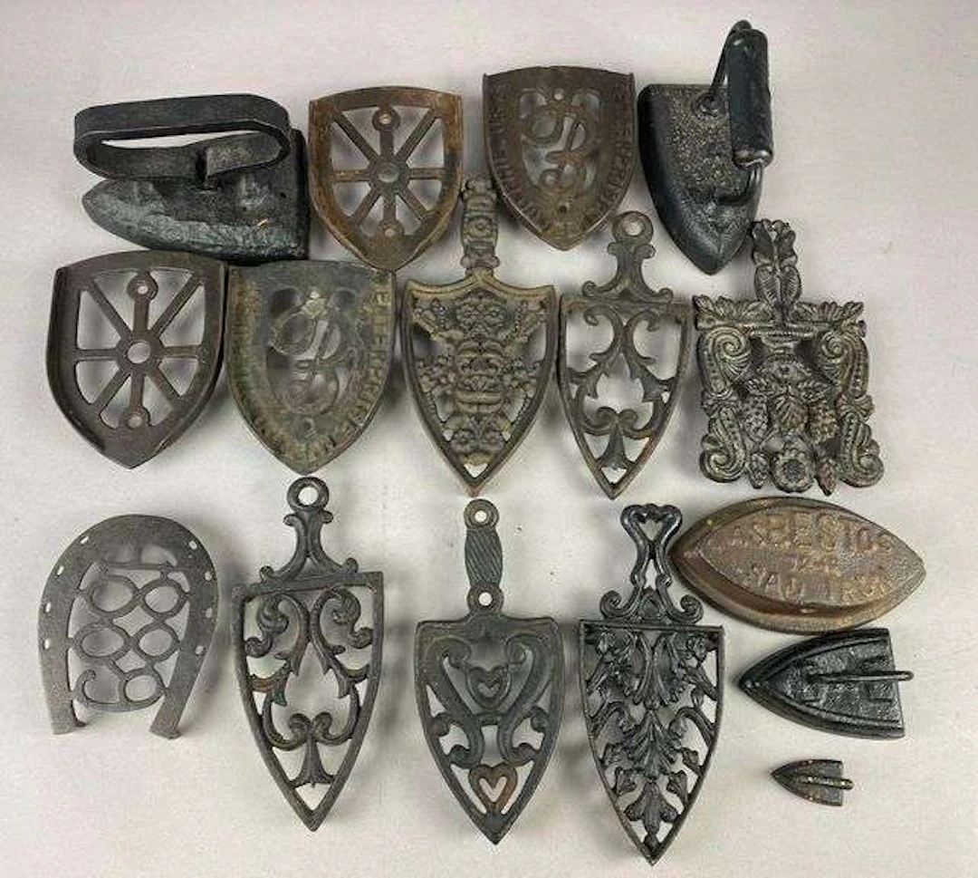 Group of Cast-Iron Sad Iron Trivets and More
