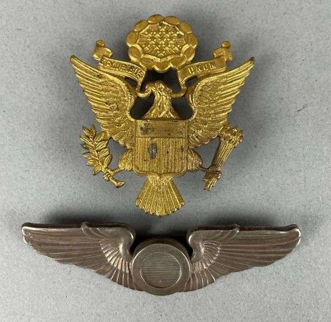 Group of 2 WW2 Australian Made U.S. Military Badges