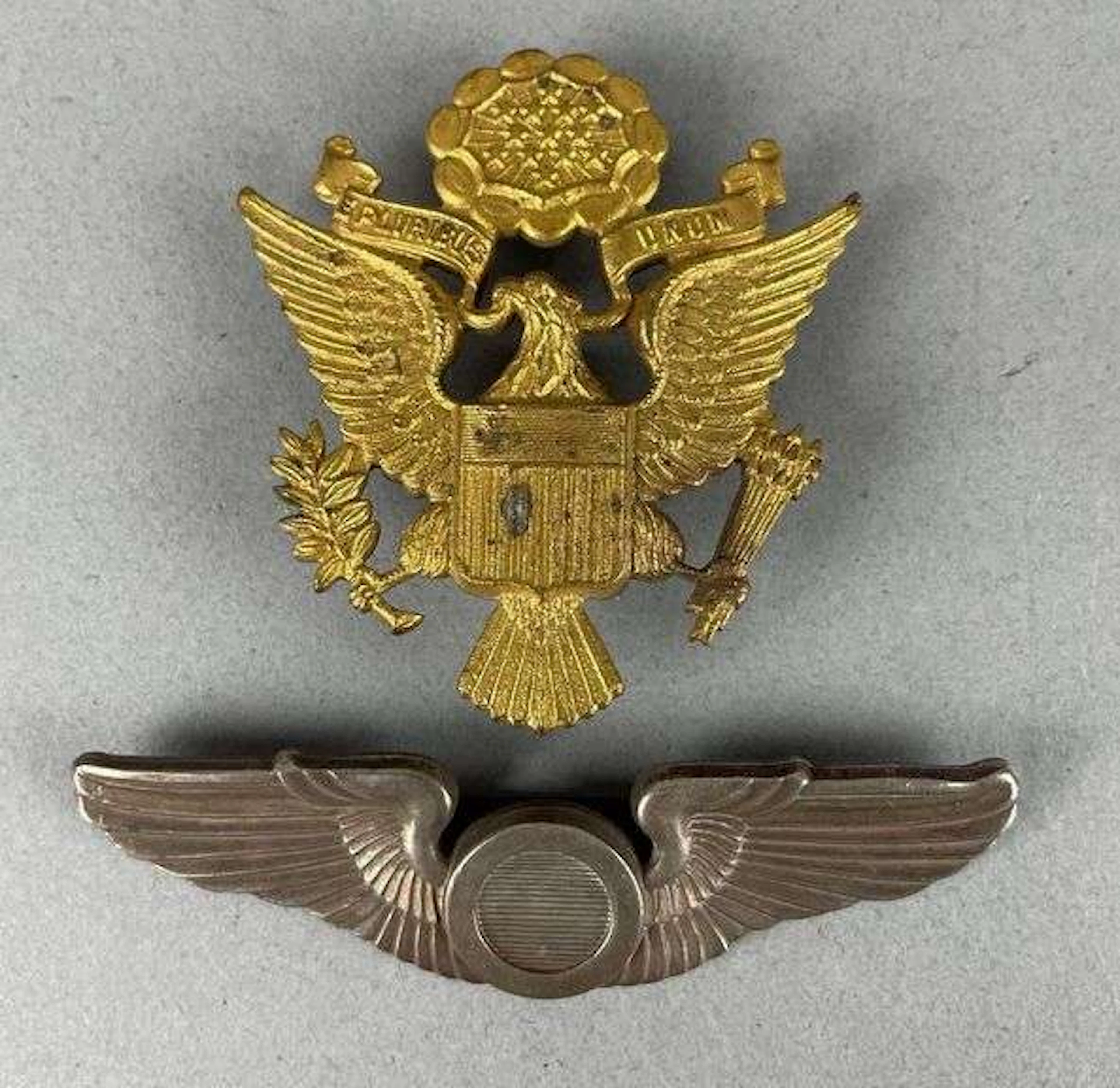 Group of 2 WW2 Australian Made U.S. Military Badges