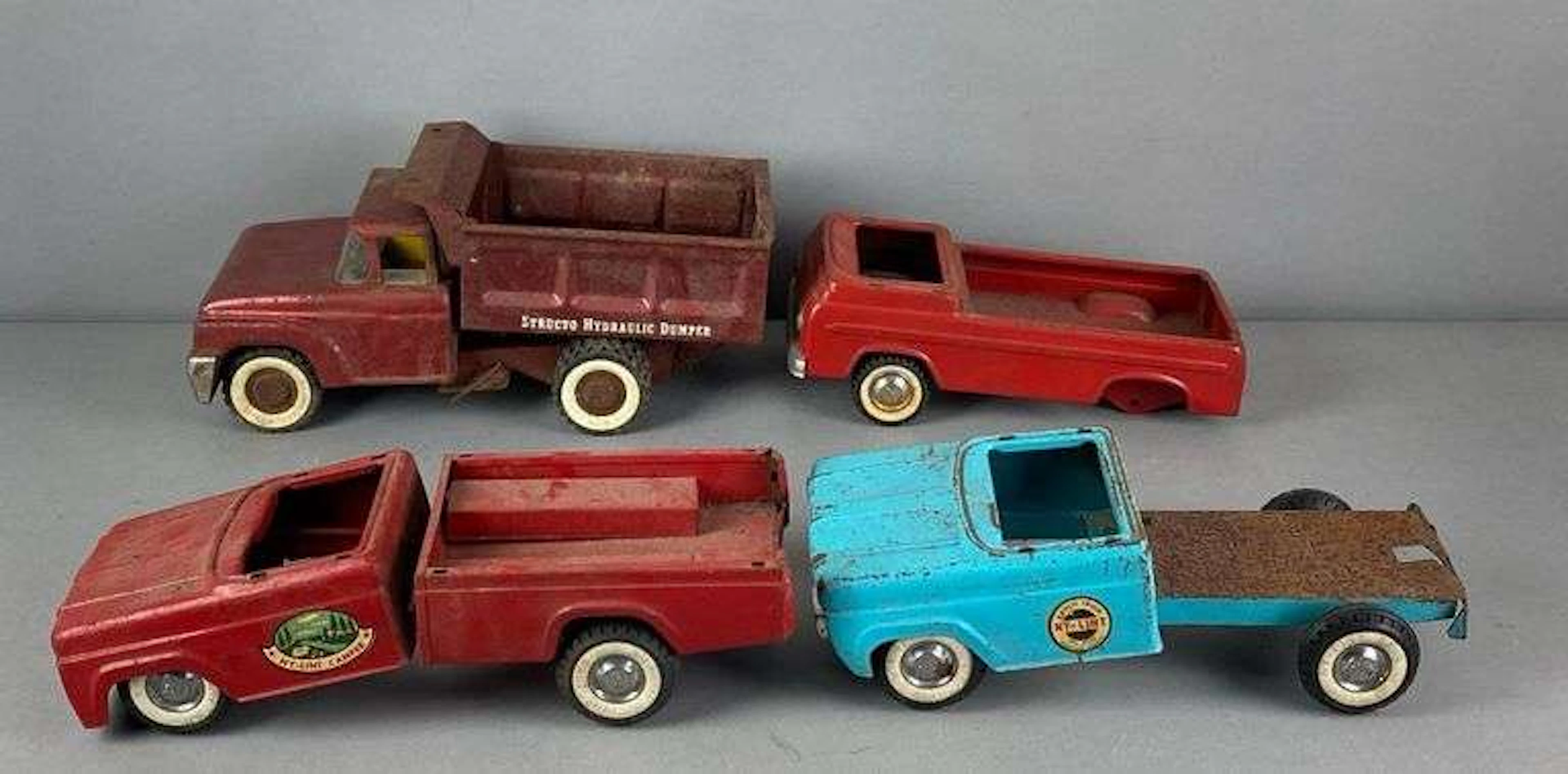 Group of Ny-Lint and Structo Pressed Steel Toy Trucks