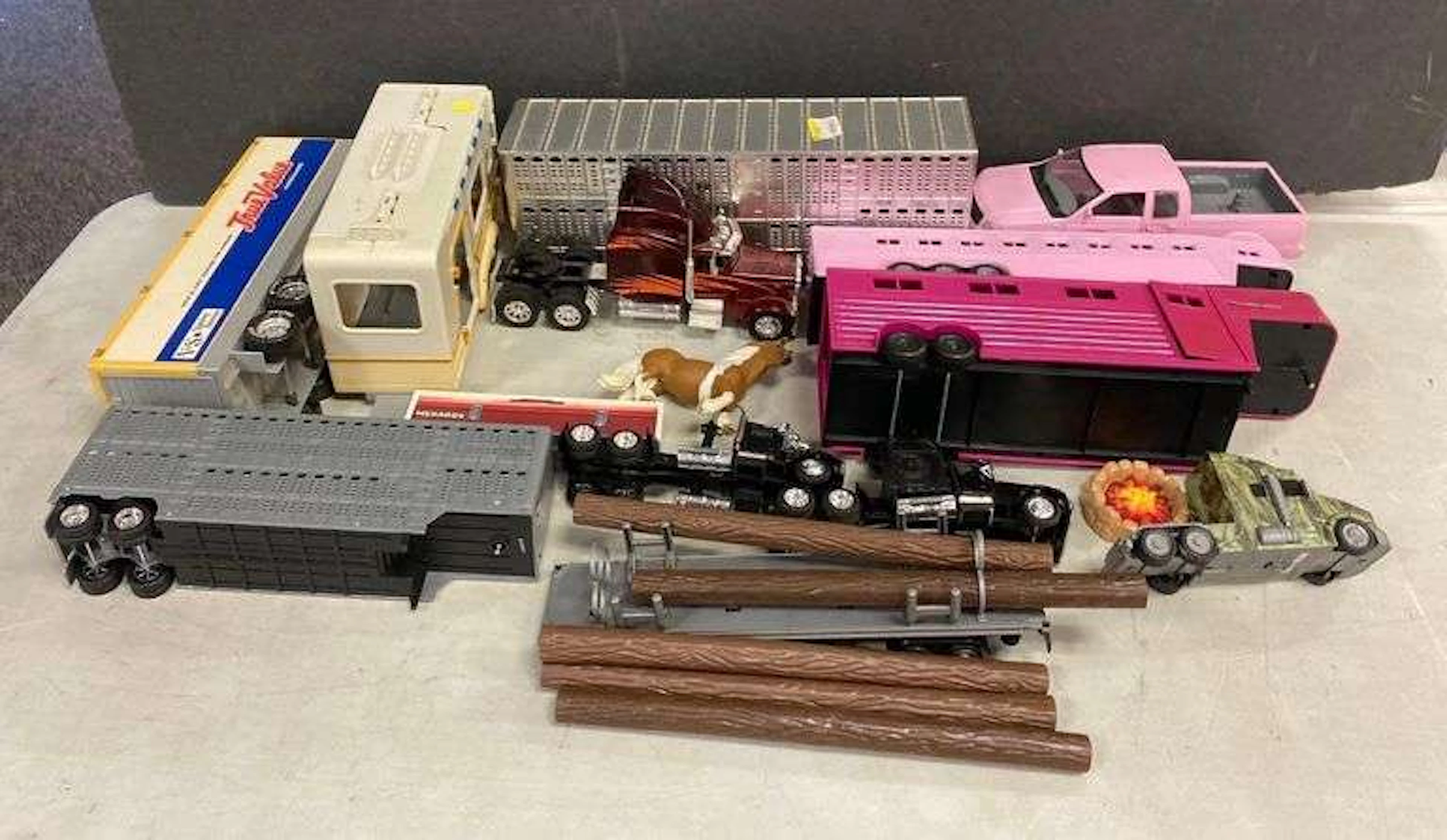 Group of Assorted Toy Trucks and More