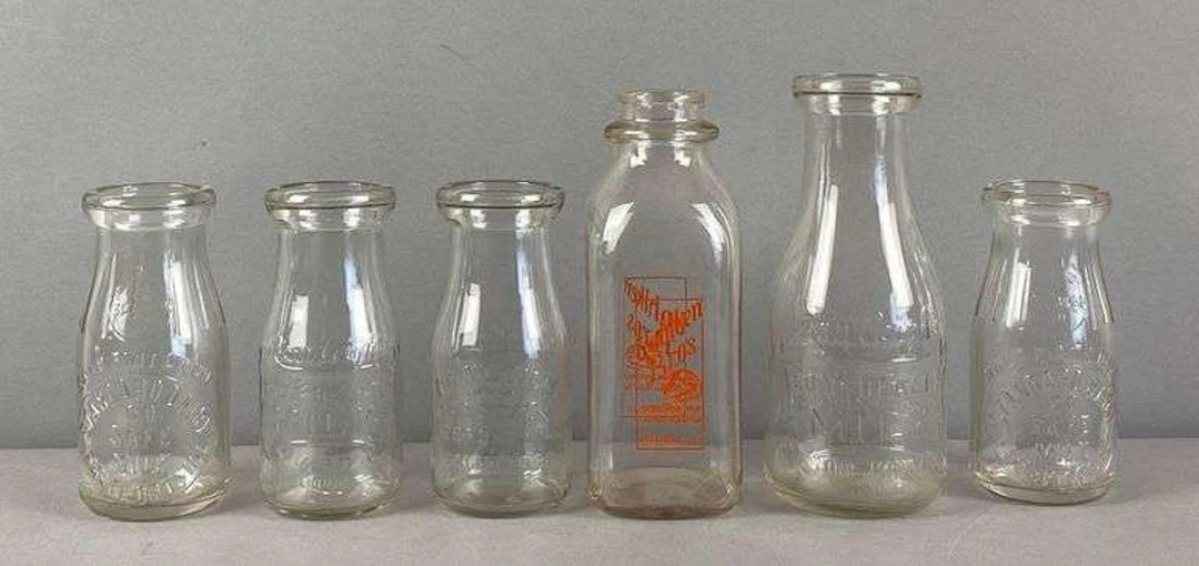 Group of 6 Glass Advertising Bottles
