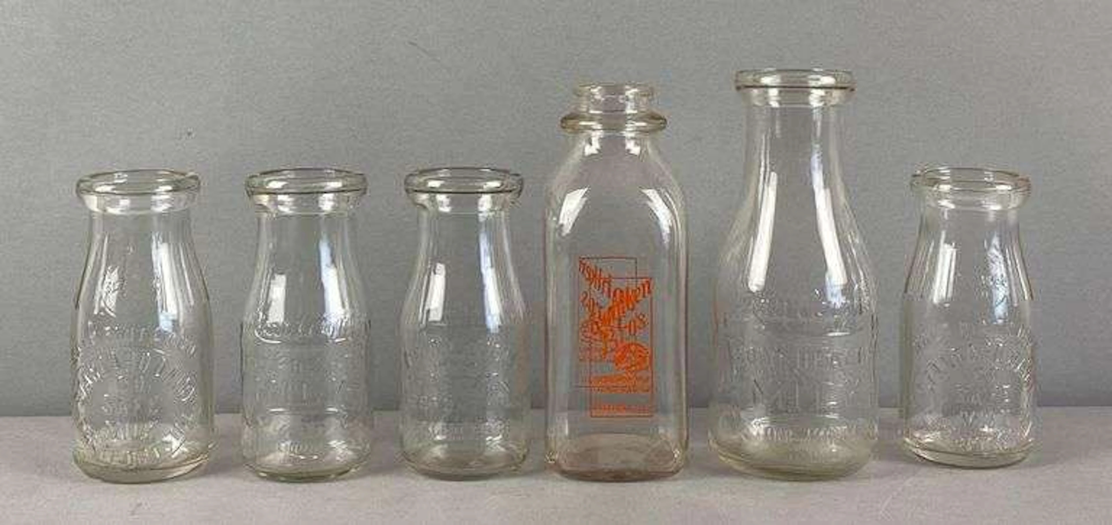 Group of 6 Glass Advertising Bottles