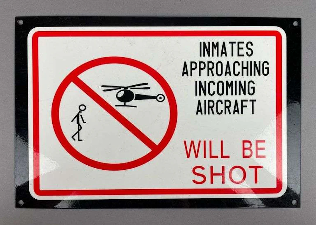 Inmates Approaching Incoming Aircraft Will be Shot Porcelain Sign