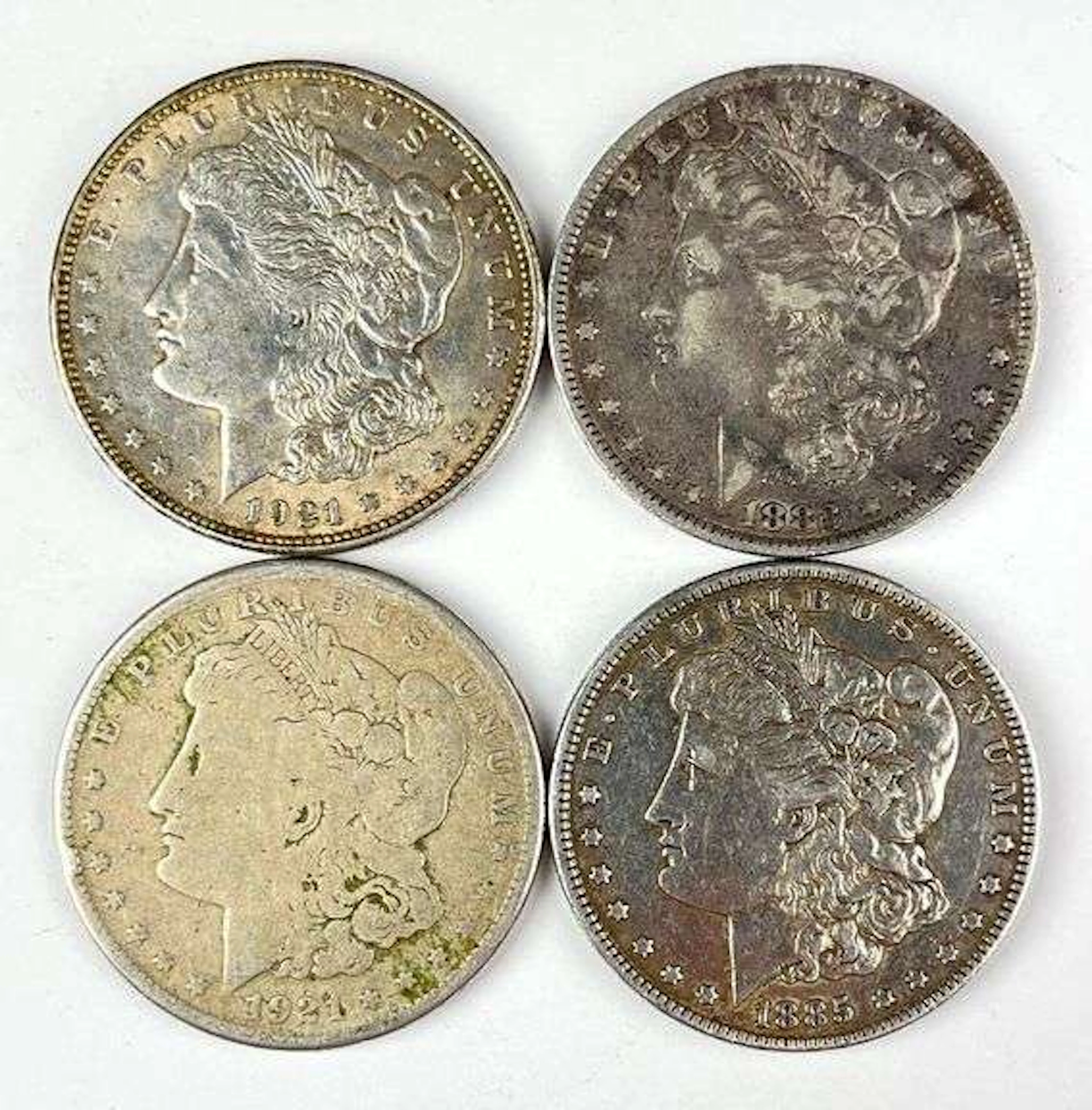 Group of 4 Morgan Silver Dollars