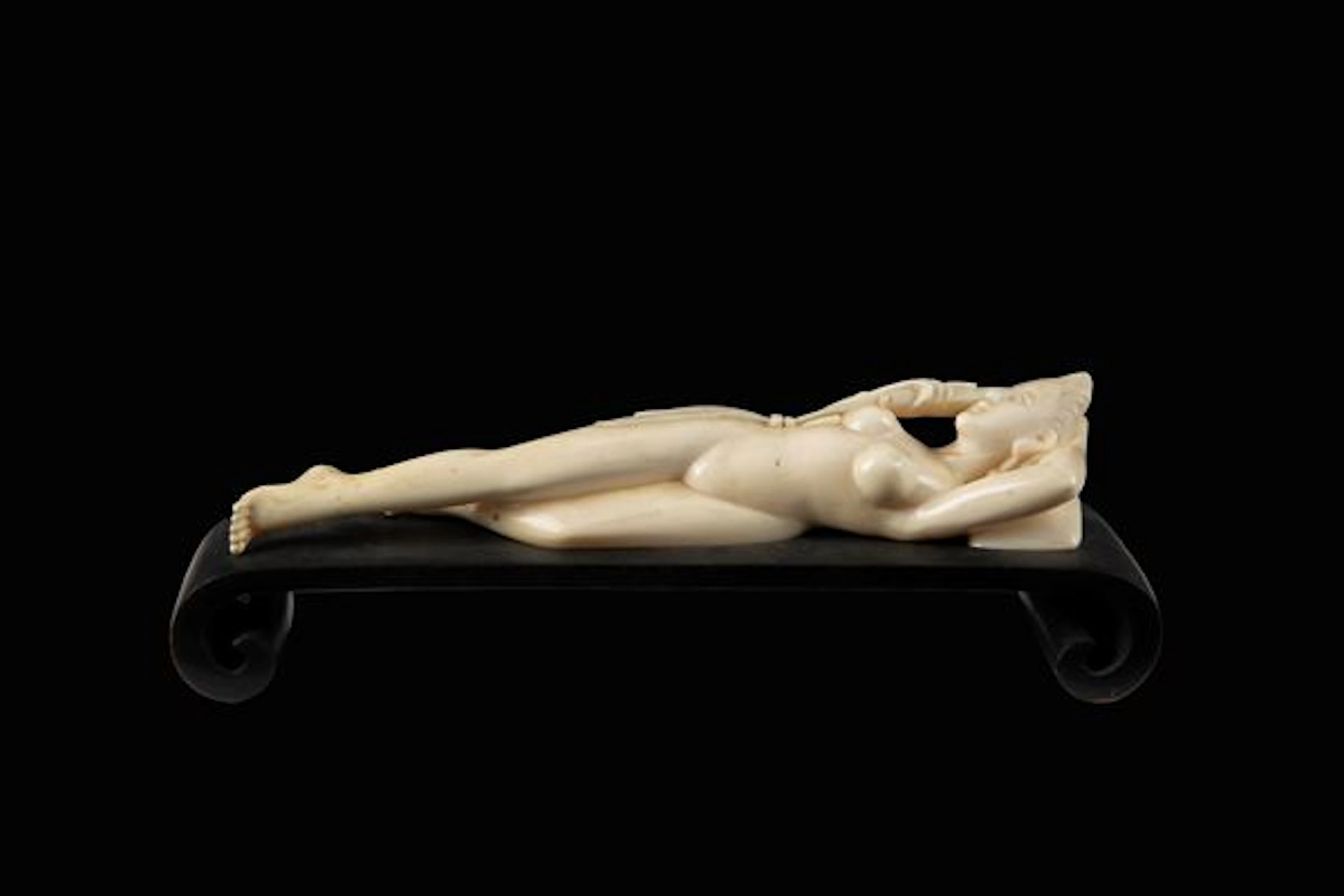 Ivory sculpture "RECLINING FEMALE FIGURE"