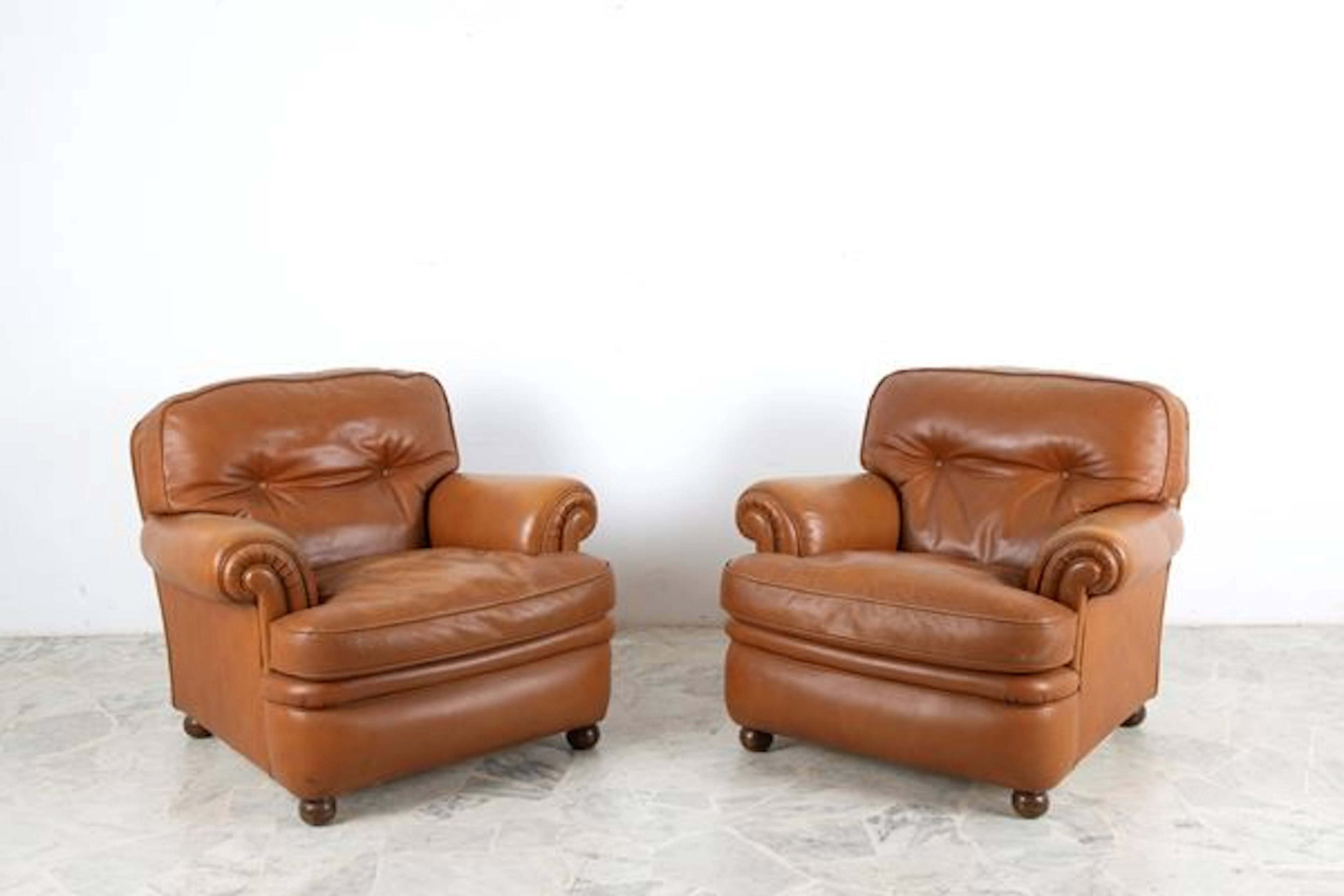 Coppia di poltrone mod. Poppy. POLTRONA FRAU
