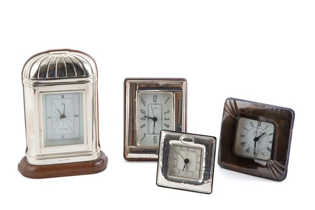 Quattro orologi in lamina d'argento