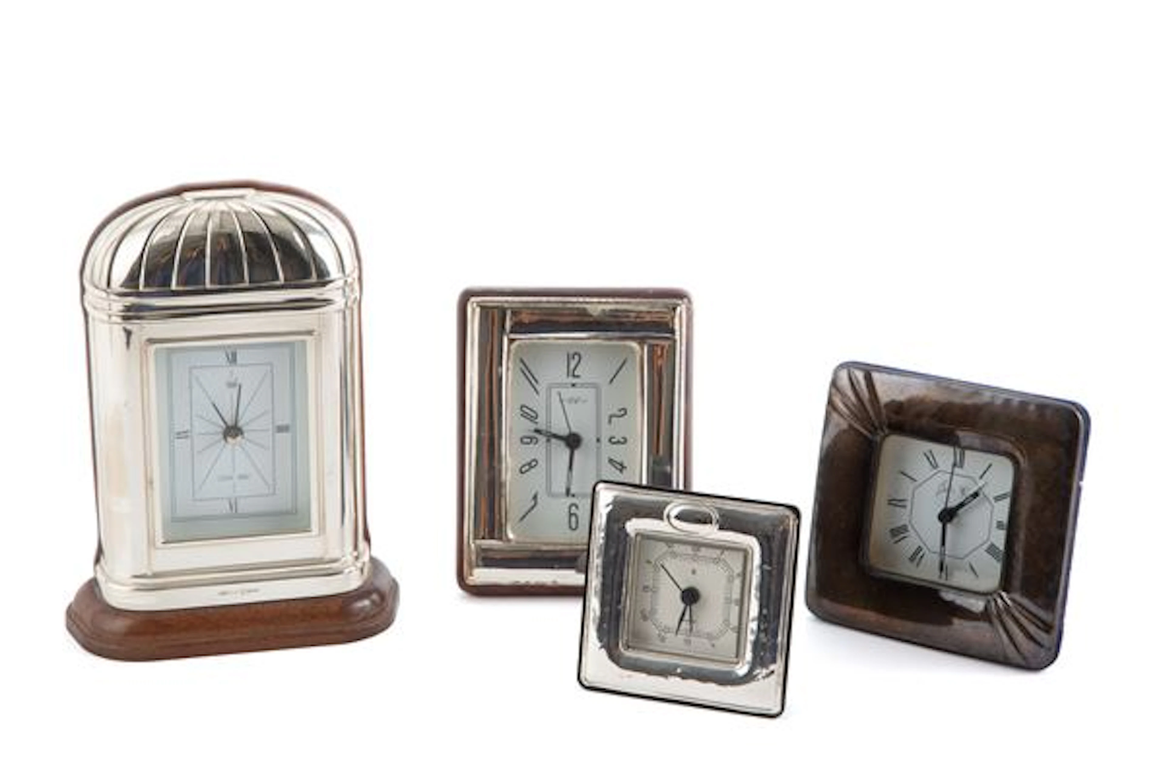 Quattro orologi in lamina d'argento