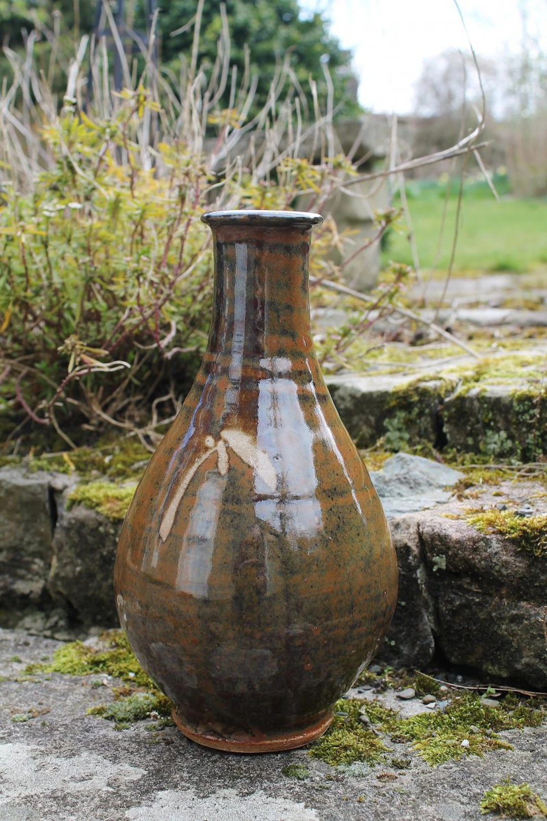 Korean type footed bottle, wax resist pattern, kaki glaze by Jim Malone