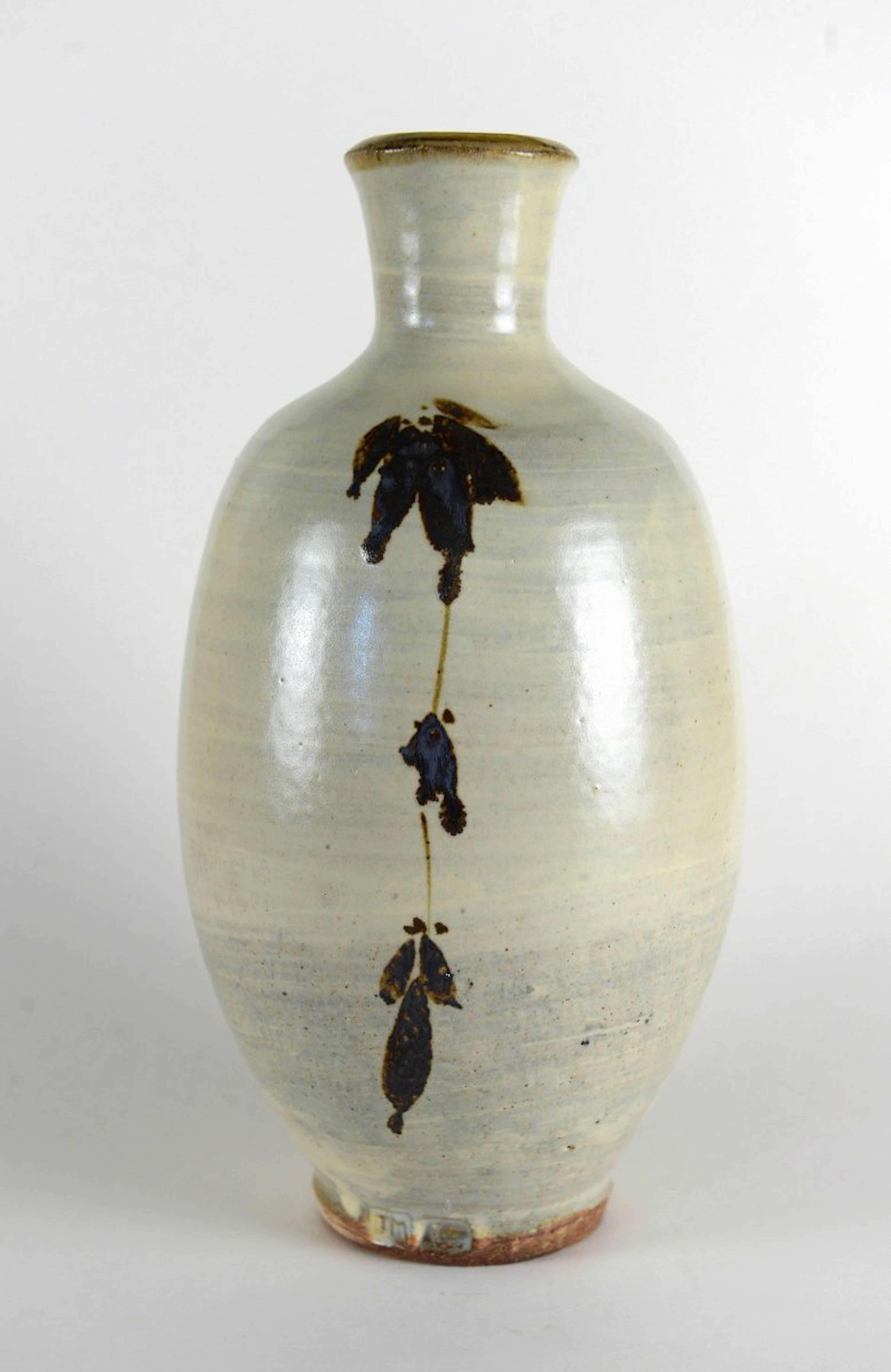 Footed bottle, white slip, iron painting by Jim Malone