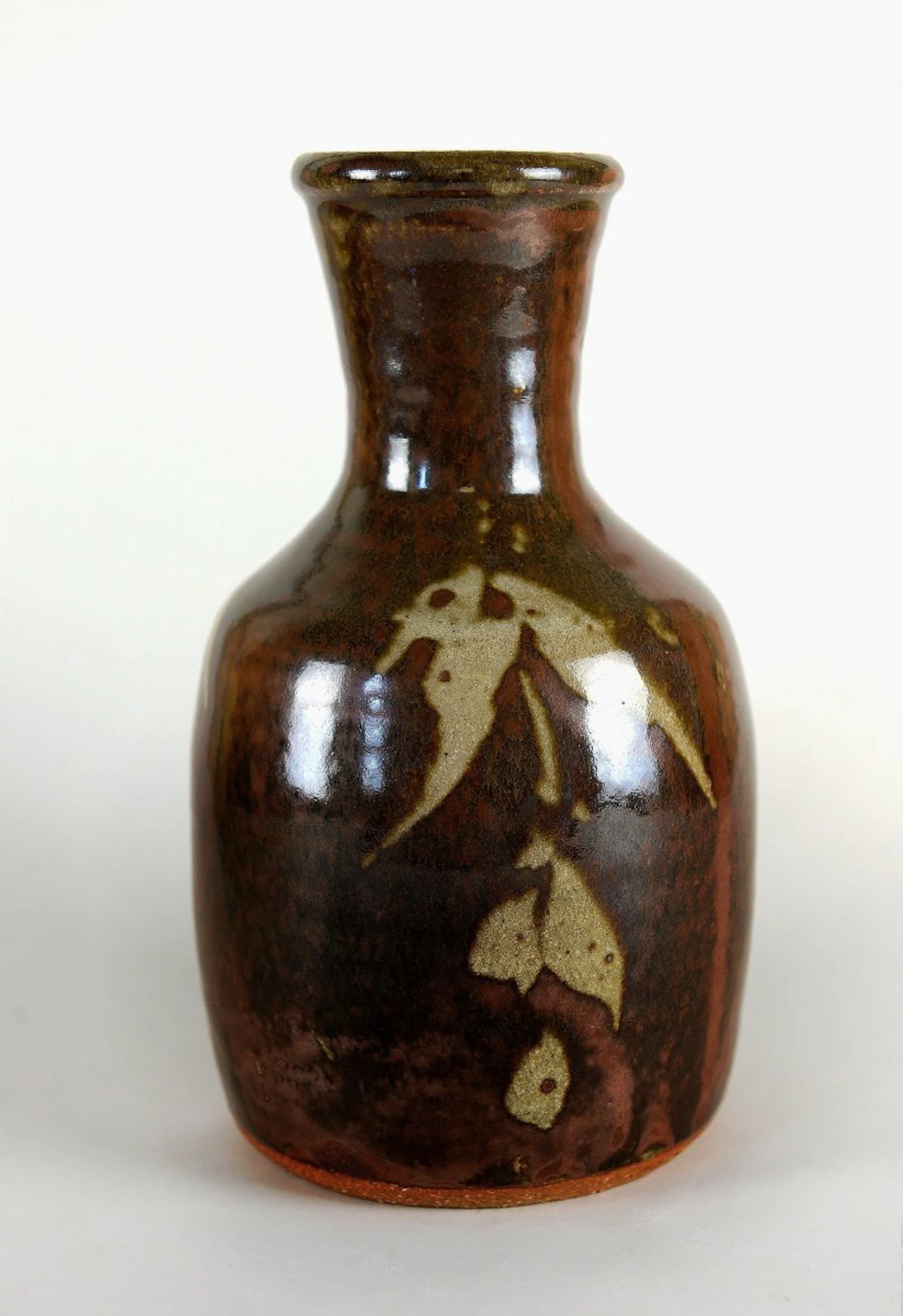 Flask vase, wax resist, kaki glaze by Jim Malone