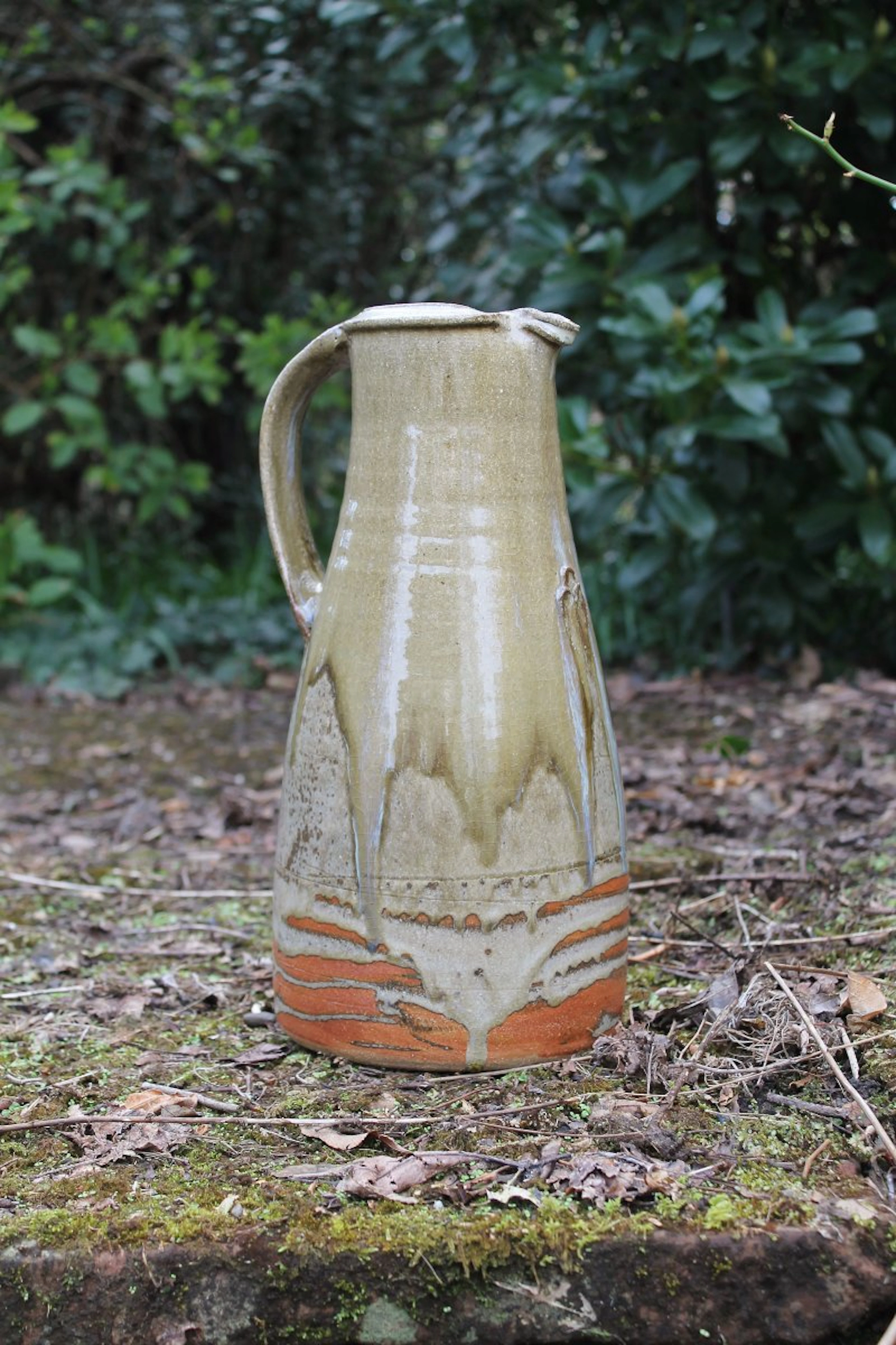 Large jug with pellets, ash glaze with nuka pours by Jim Malone